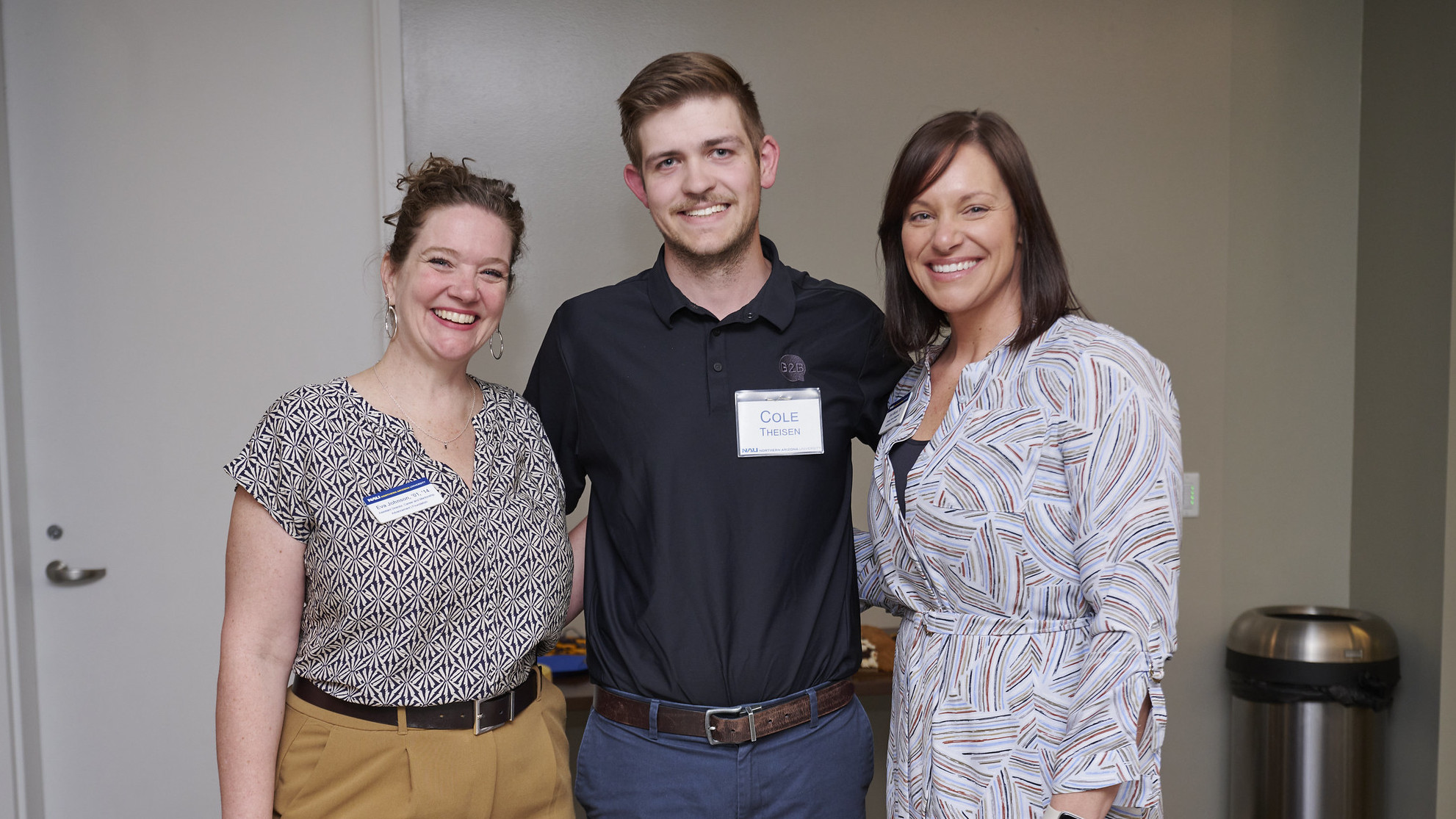 NAU Lumberjacks Thrive staff and alumni posing for photo.