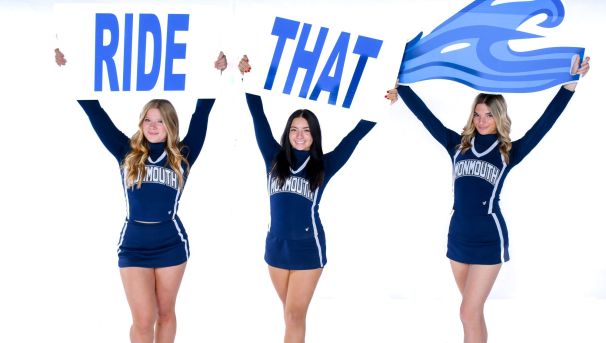 Monmouth University Cheerleaders holding signs that read "Ride That Wave"