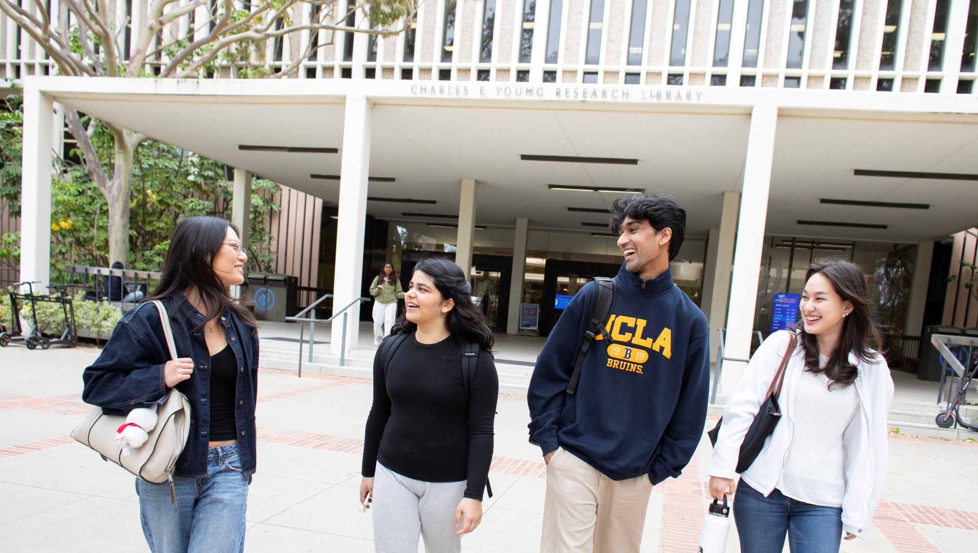 Students walking in front of Charles E. Young Research Library