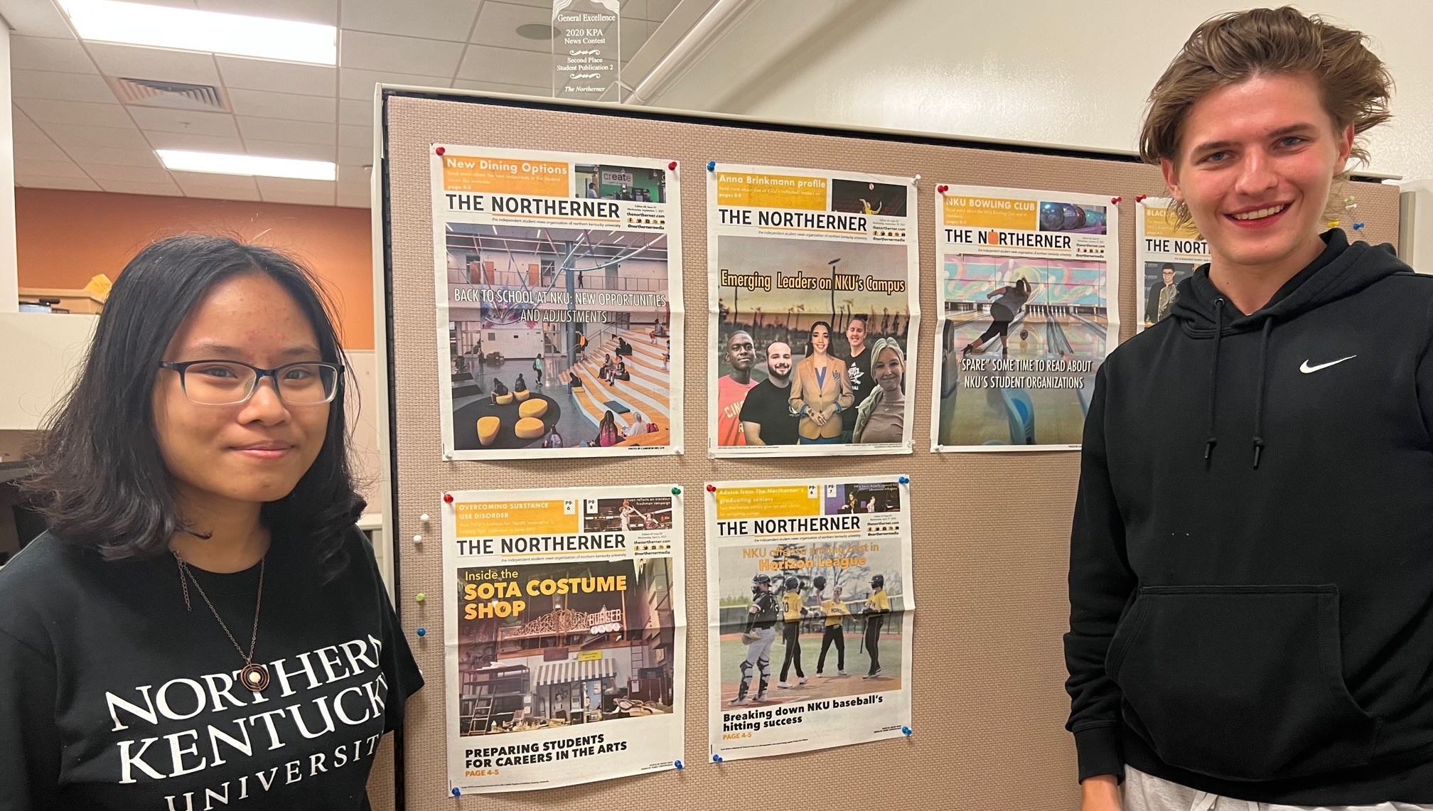Northerner staffers in office with past issues of the Northern being displayed