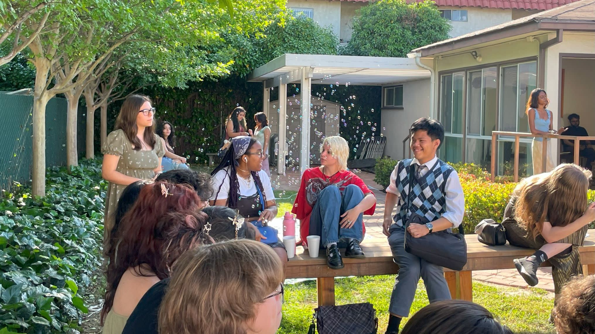 Group of students enjoying the sunny outdoors.