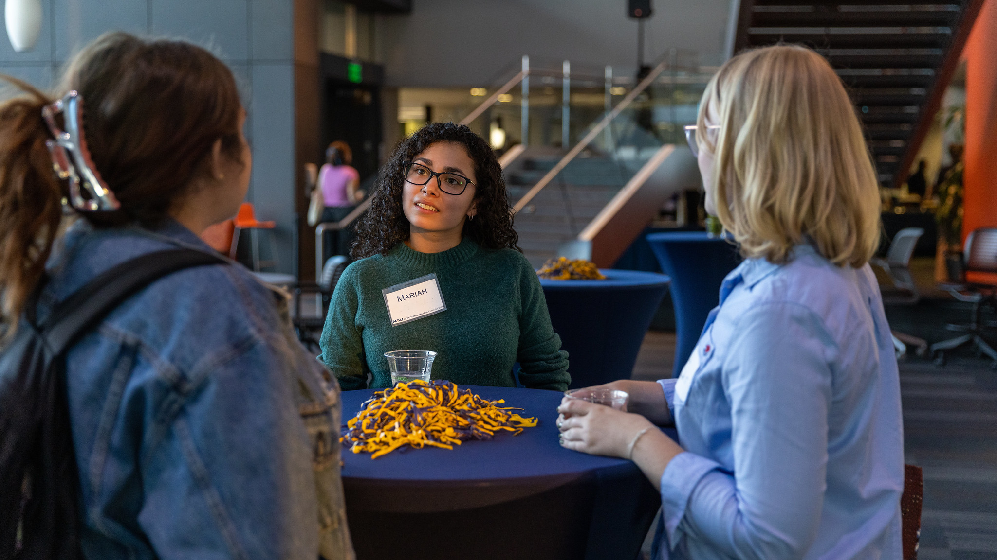 NAU alum chatting at Lumberjacks Thrive Career Mixer