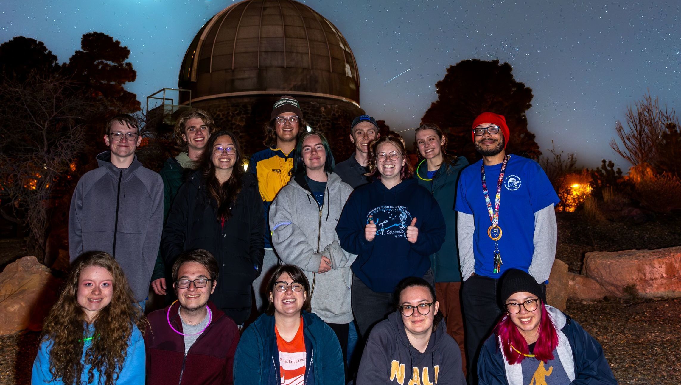 Club members standing outside the campus observatory