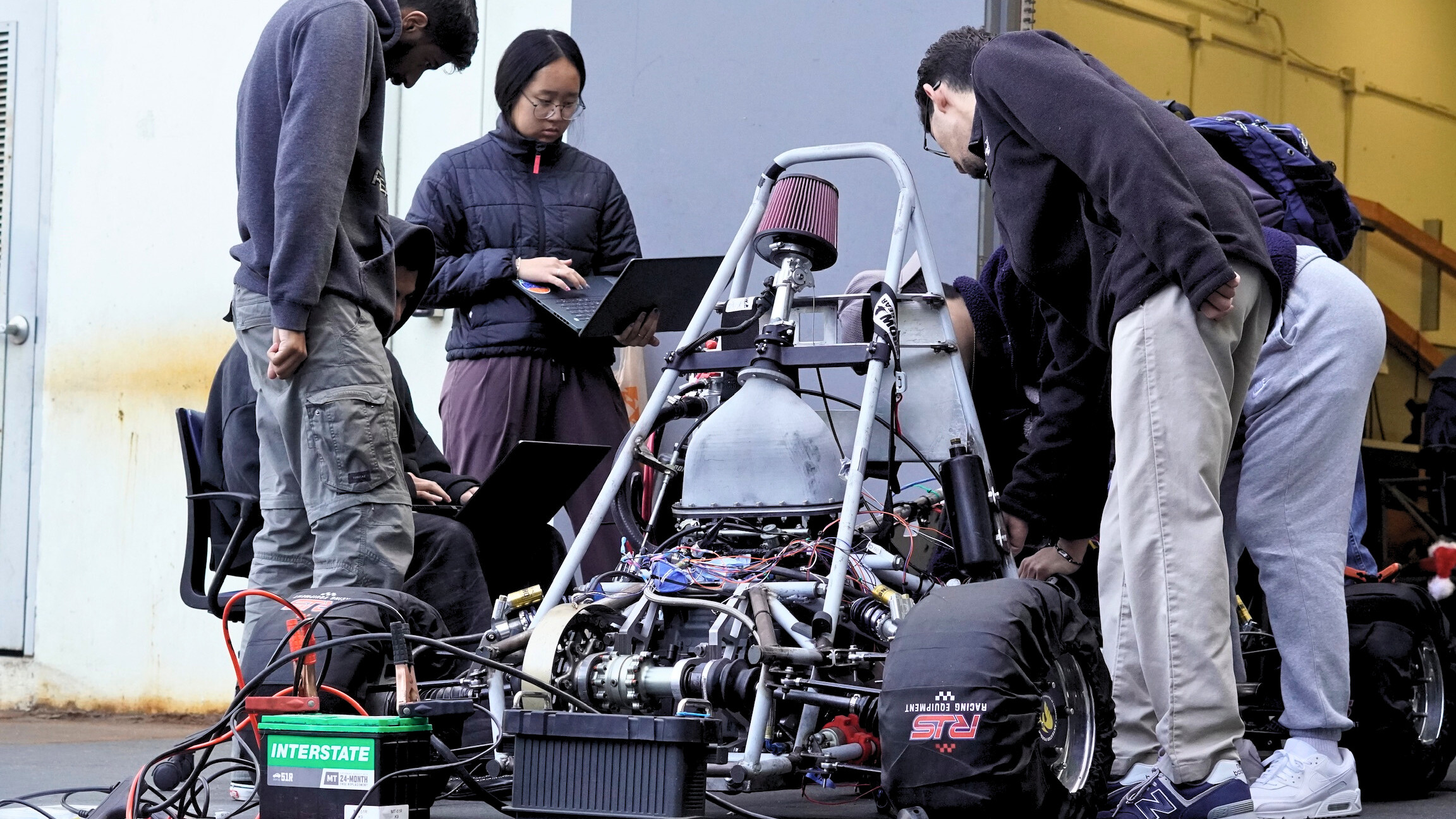 AFR members tune the engine and review data during a long day in the shop