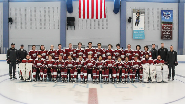 Hockey team standing together on the rink in the Jones Center