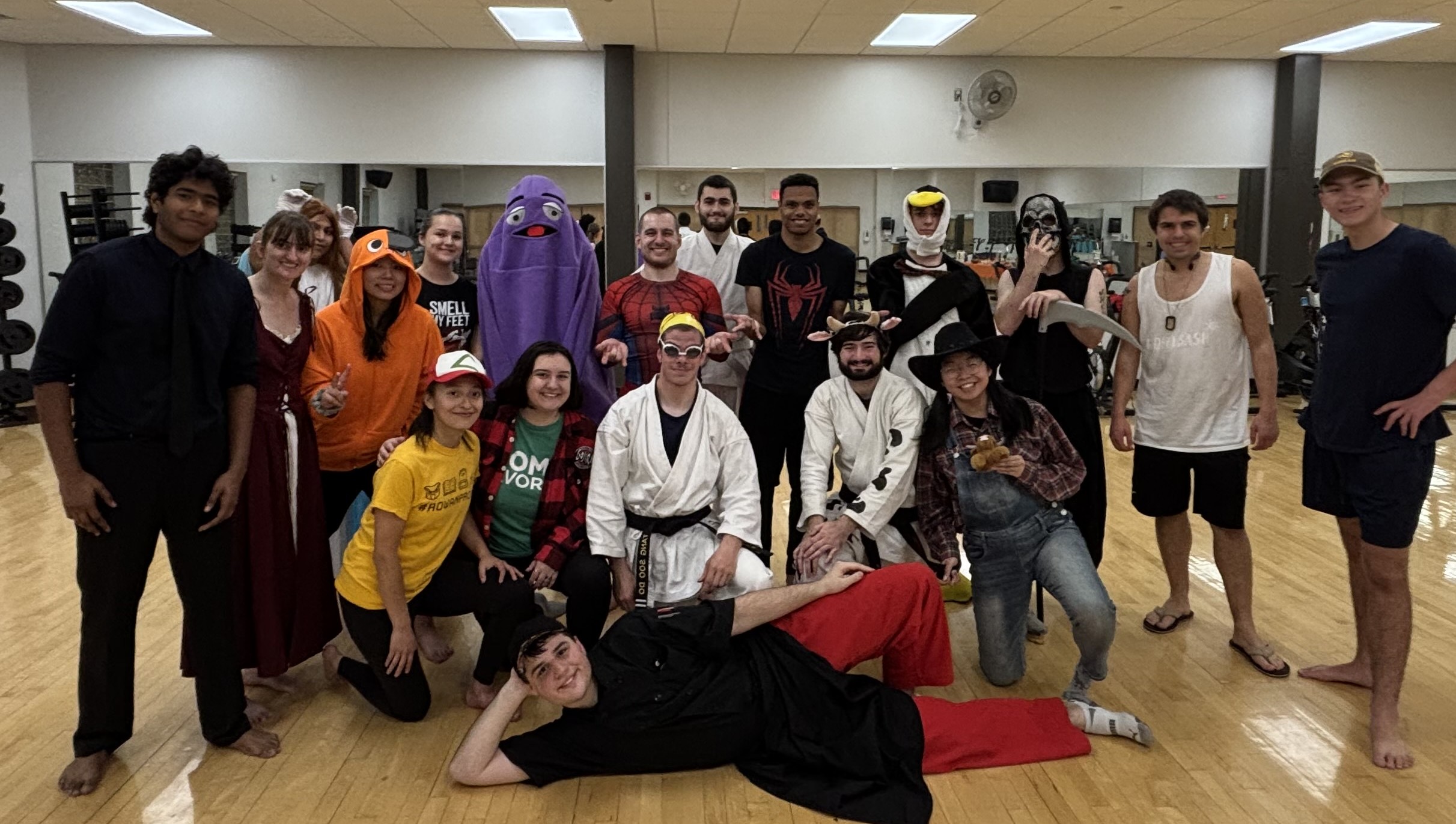 Group shot of karate and self-defense club at Halloween practice.