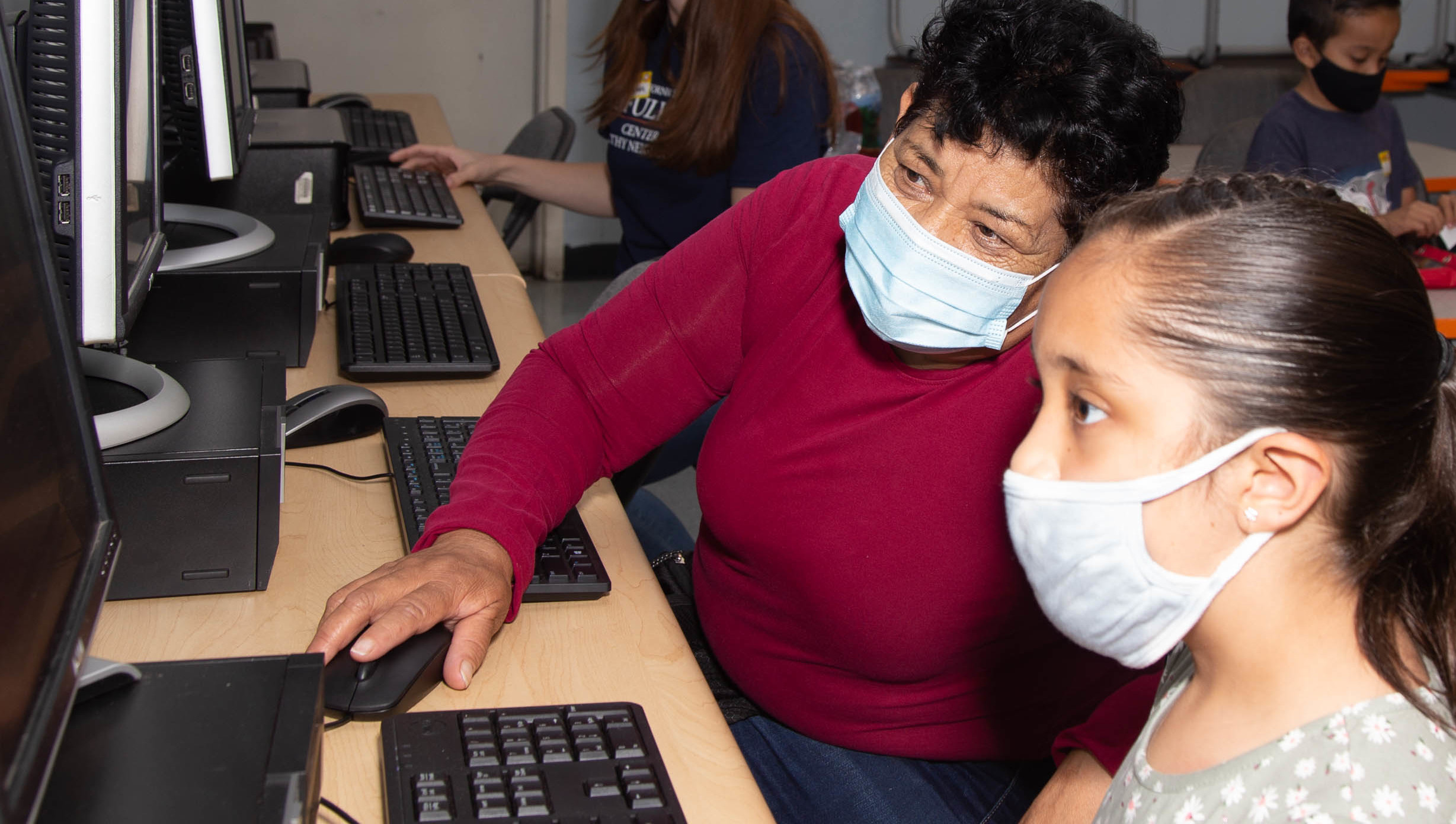 Parent with Child working on computer