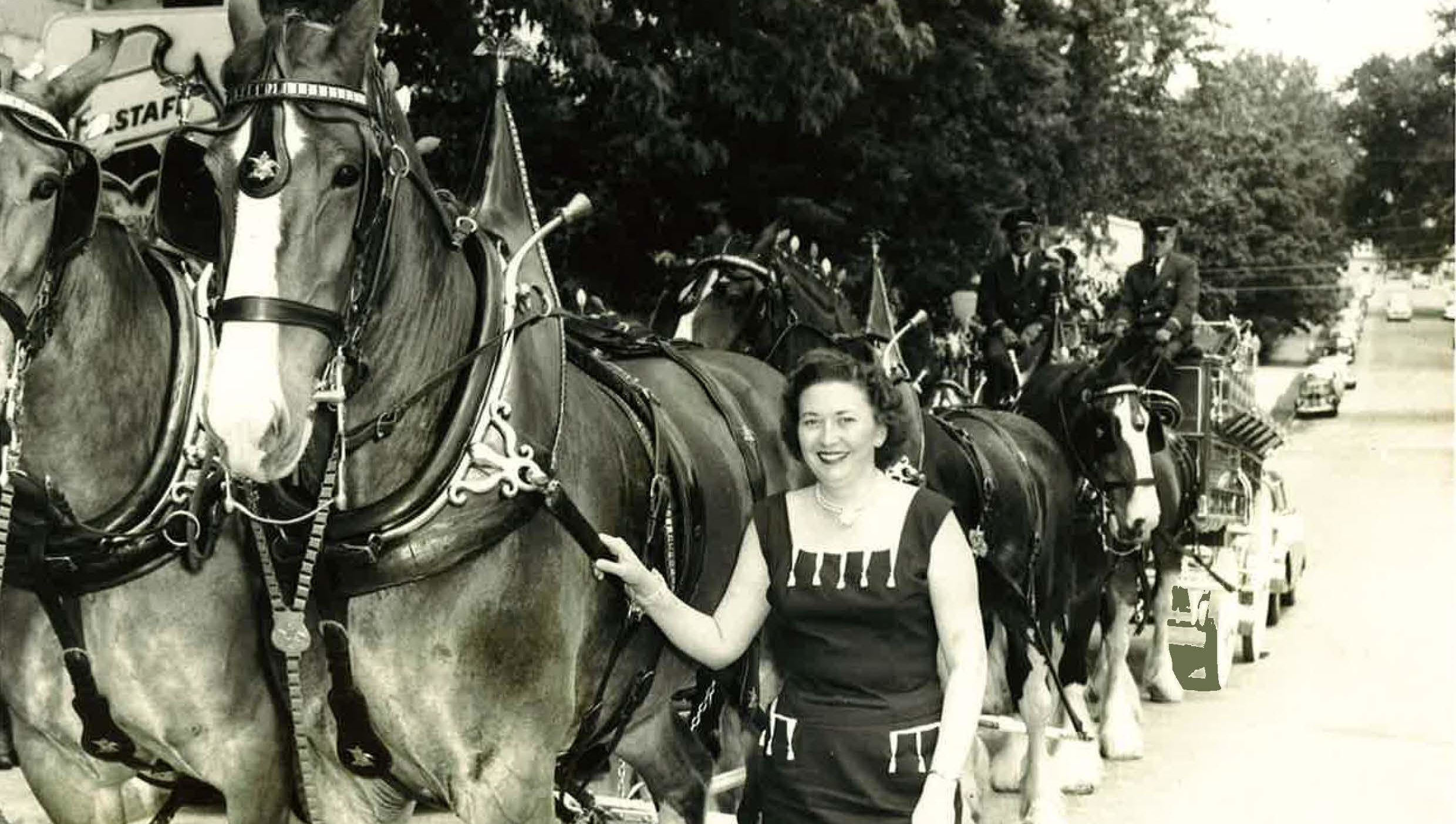 Maxine with the Budwesier Clydesdales on Block St.