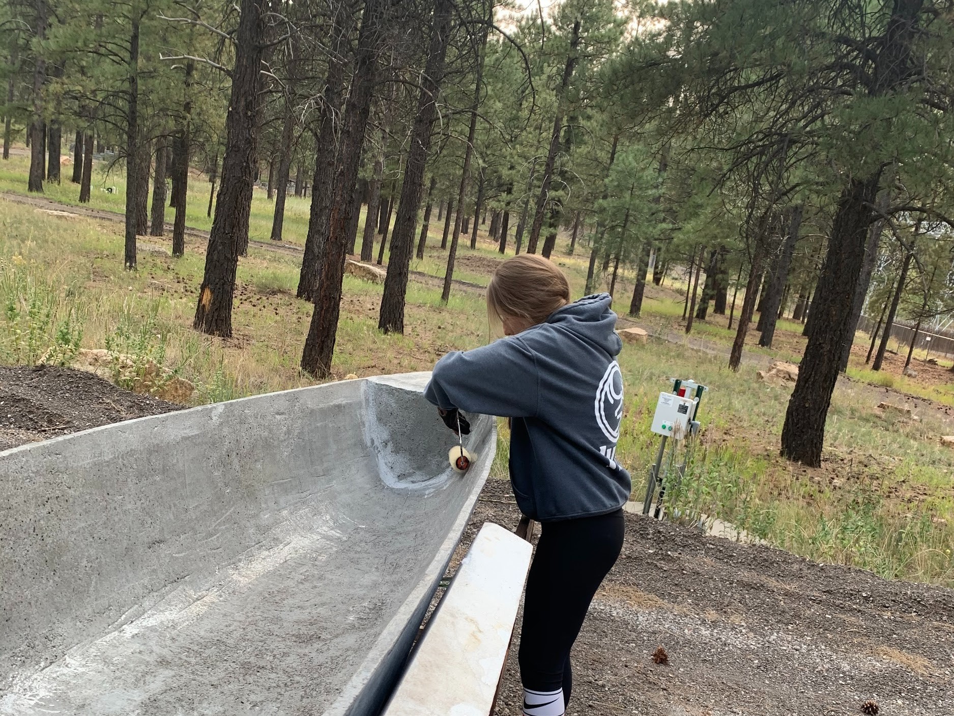 Concrete Canoe sealing their canoe