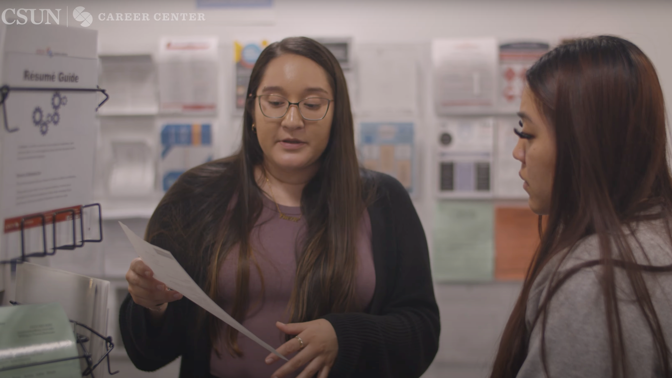 Career Center staff guides student through resume feedback and job readiness.