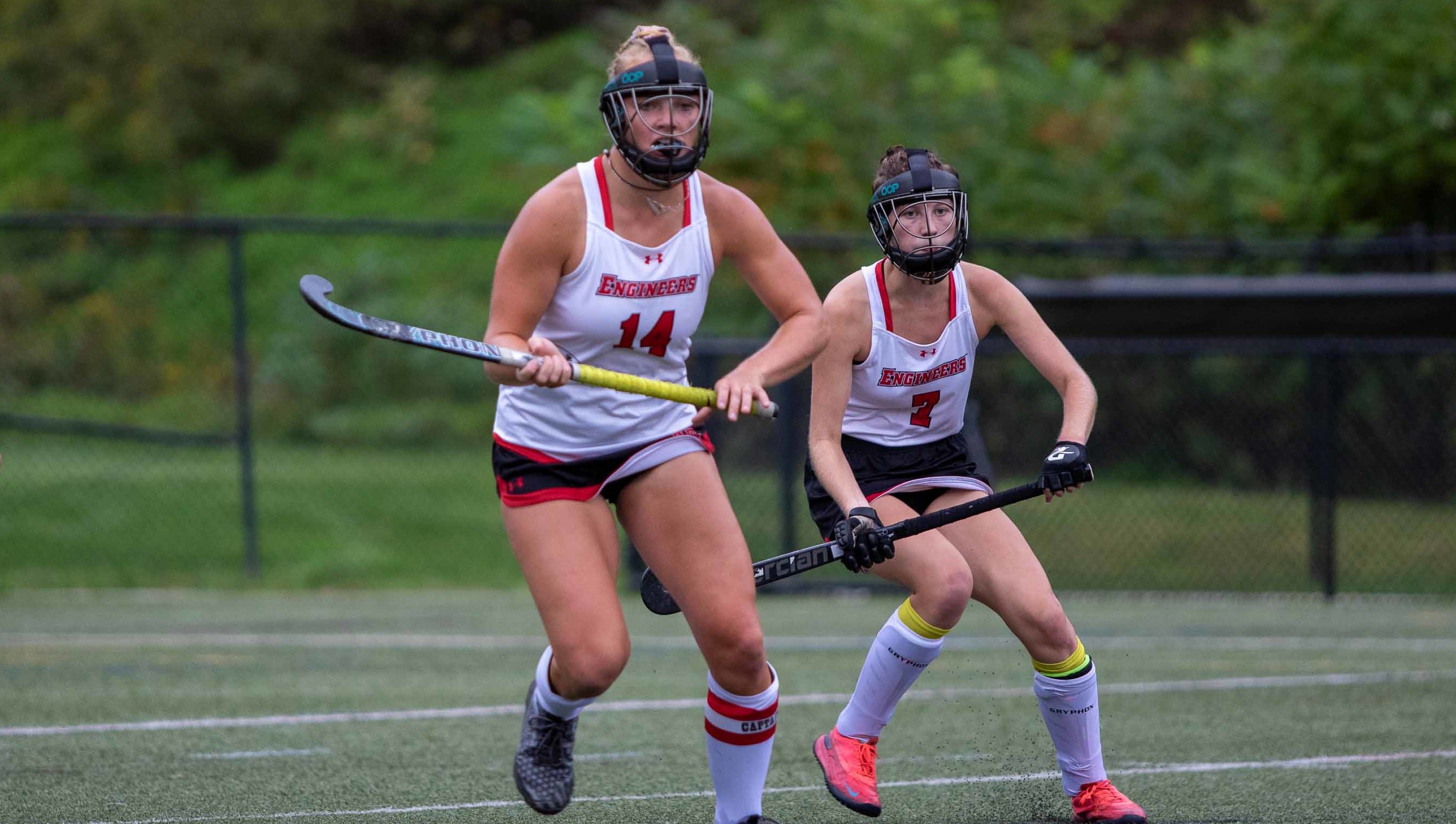 Two field hockey players on the field