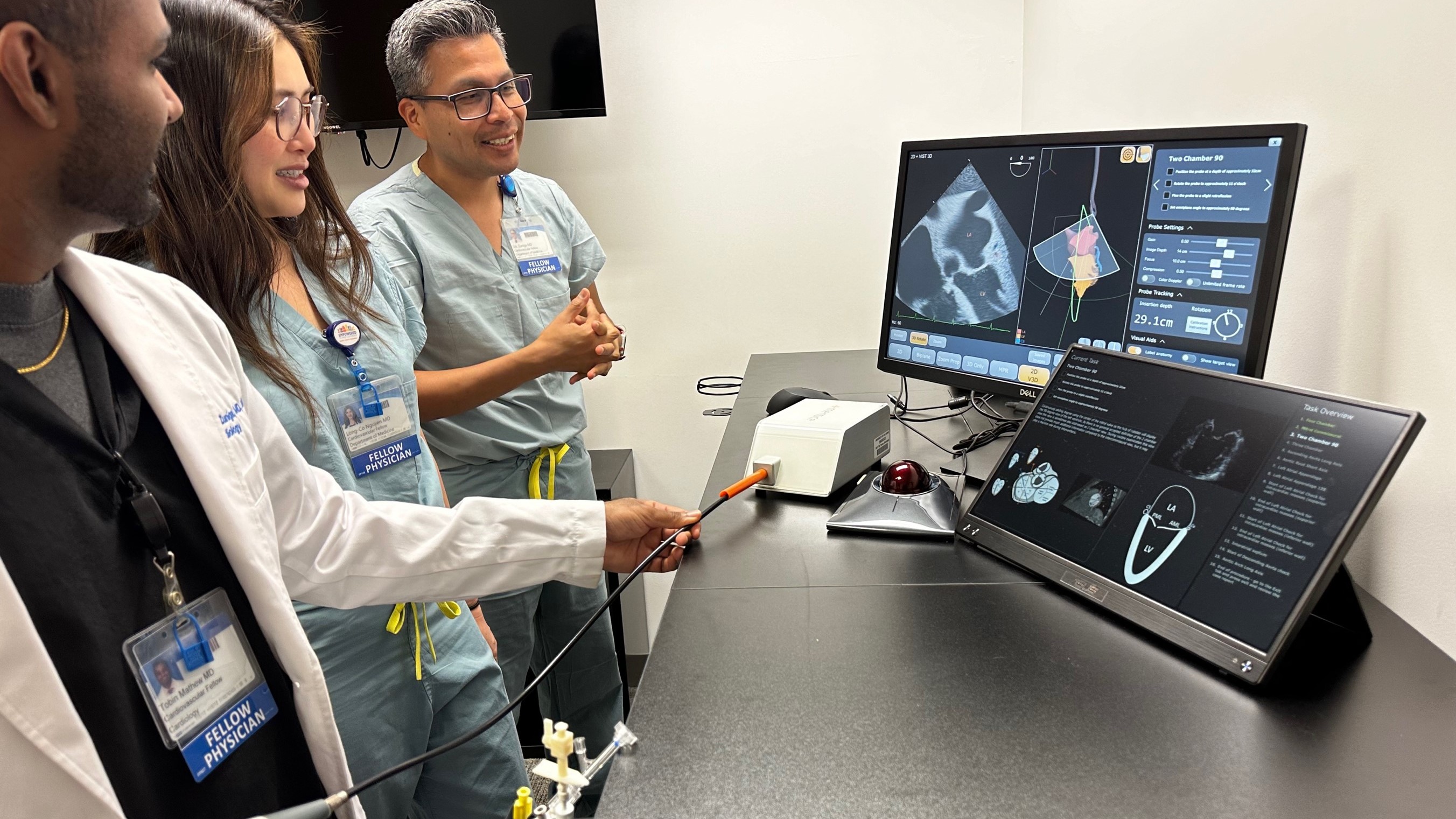 Three UCI physicians practice echocardiography procedures with cardiac imaging software