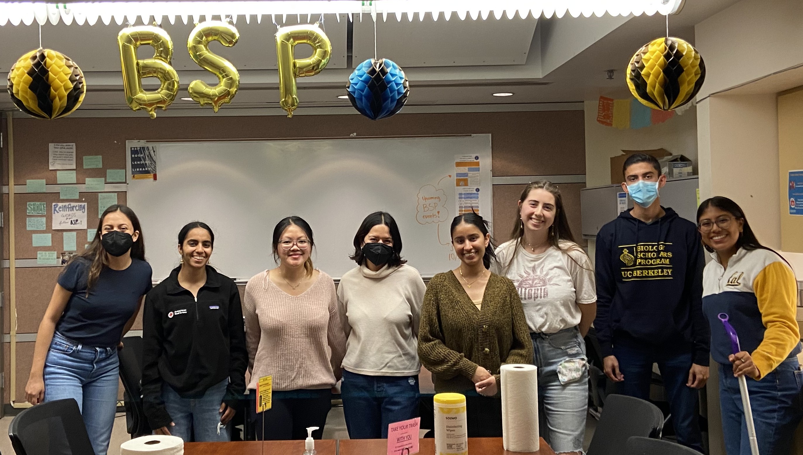 Group of BSP students standing in a row after a volunteer room cleanup.