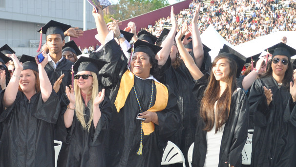 UWW graduates in their caps and gowns at the main UMass Amherst commencement.