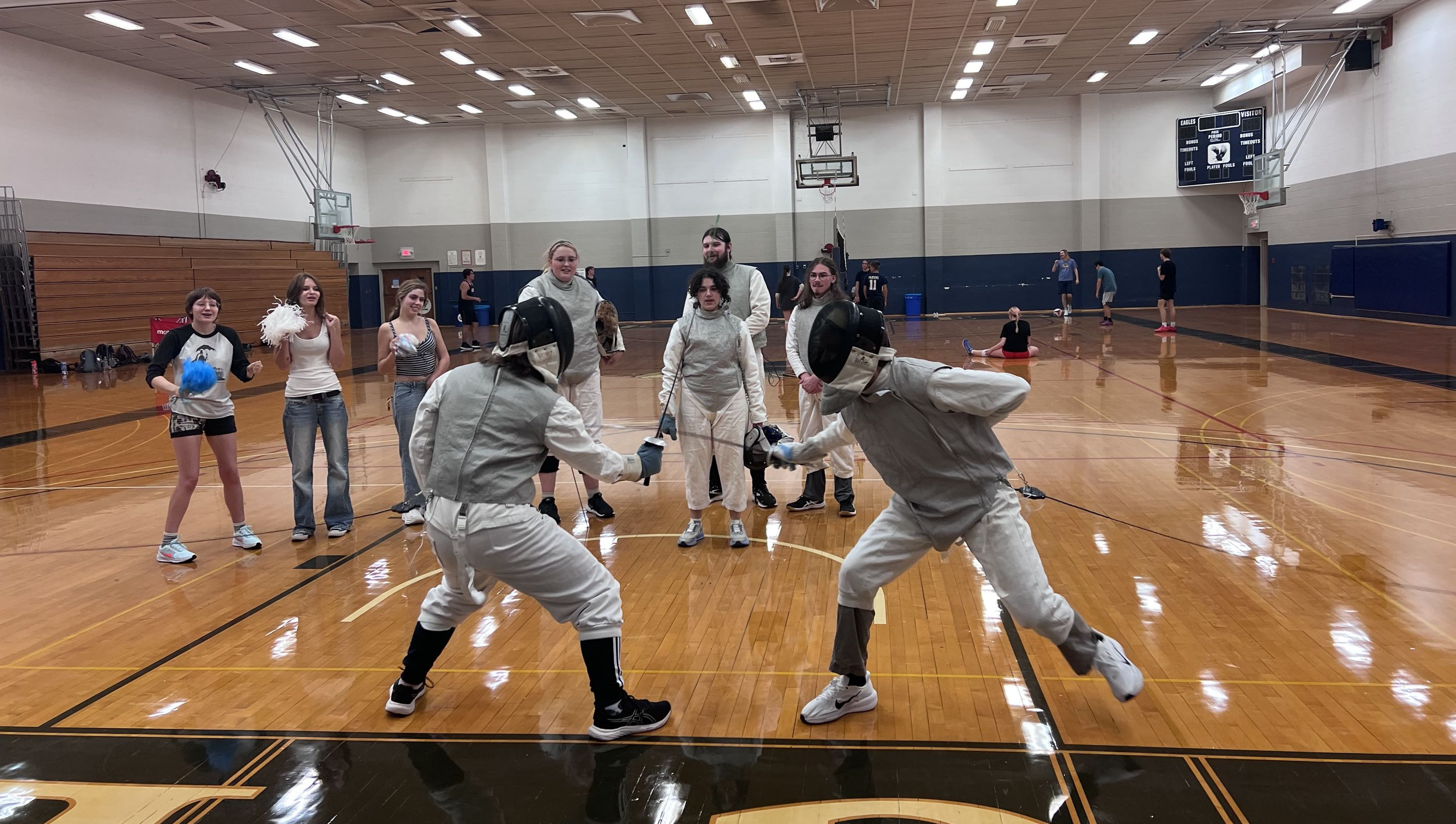 Two fencers battling against each other