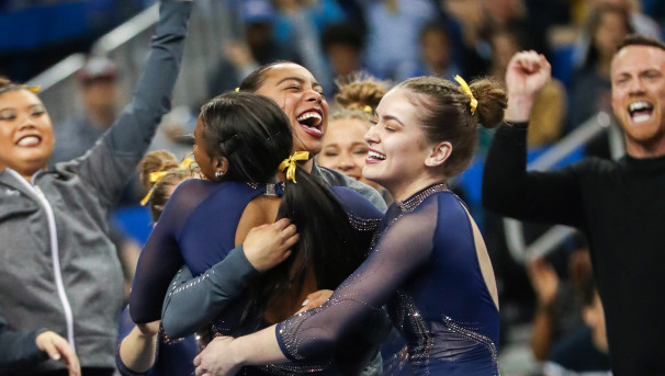 Teammates hugging each other in celebration