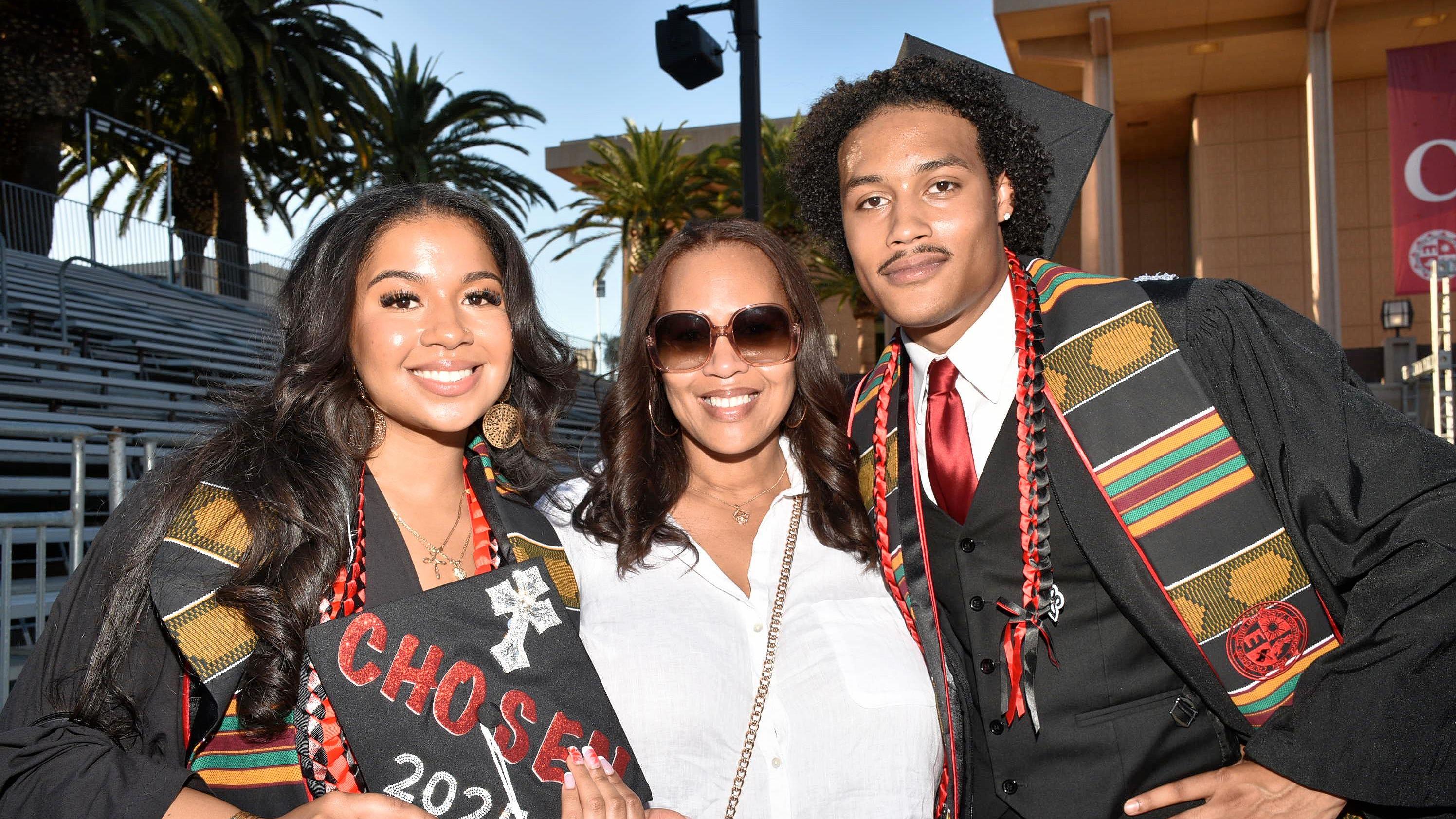 Students posing in graduation regalia