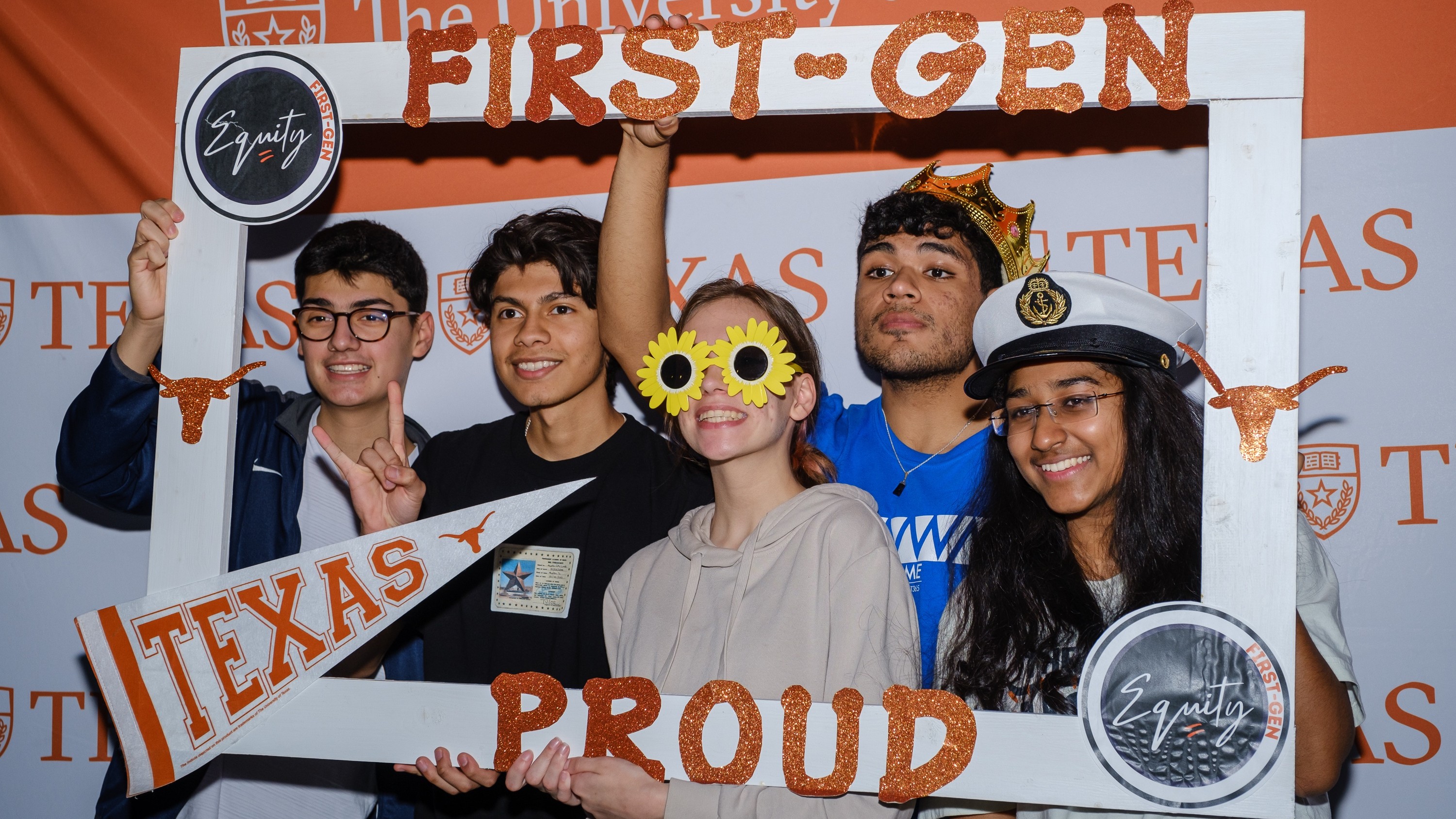 Five undergraduate students holding First-Gen Proud sign.