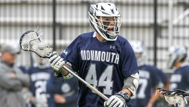 Monmouth men's lacrosse student-athletes celebrate a goal.
