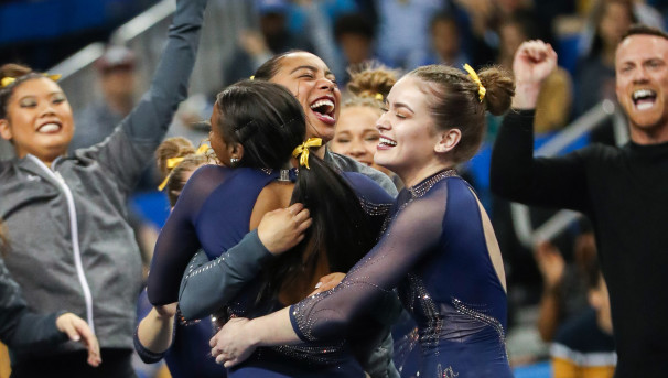 Teammates hugging each other in celebration