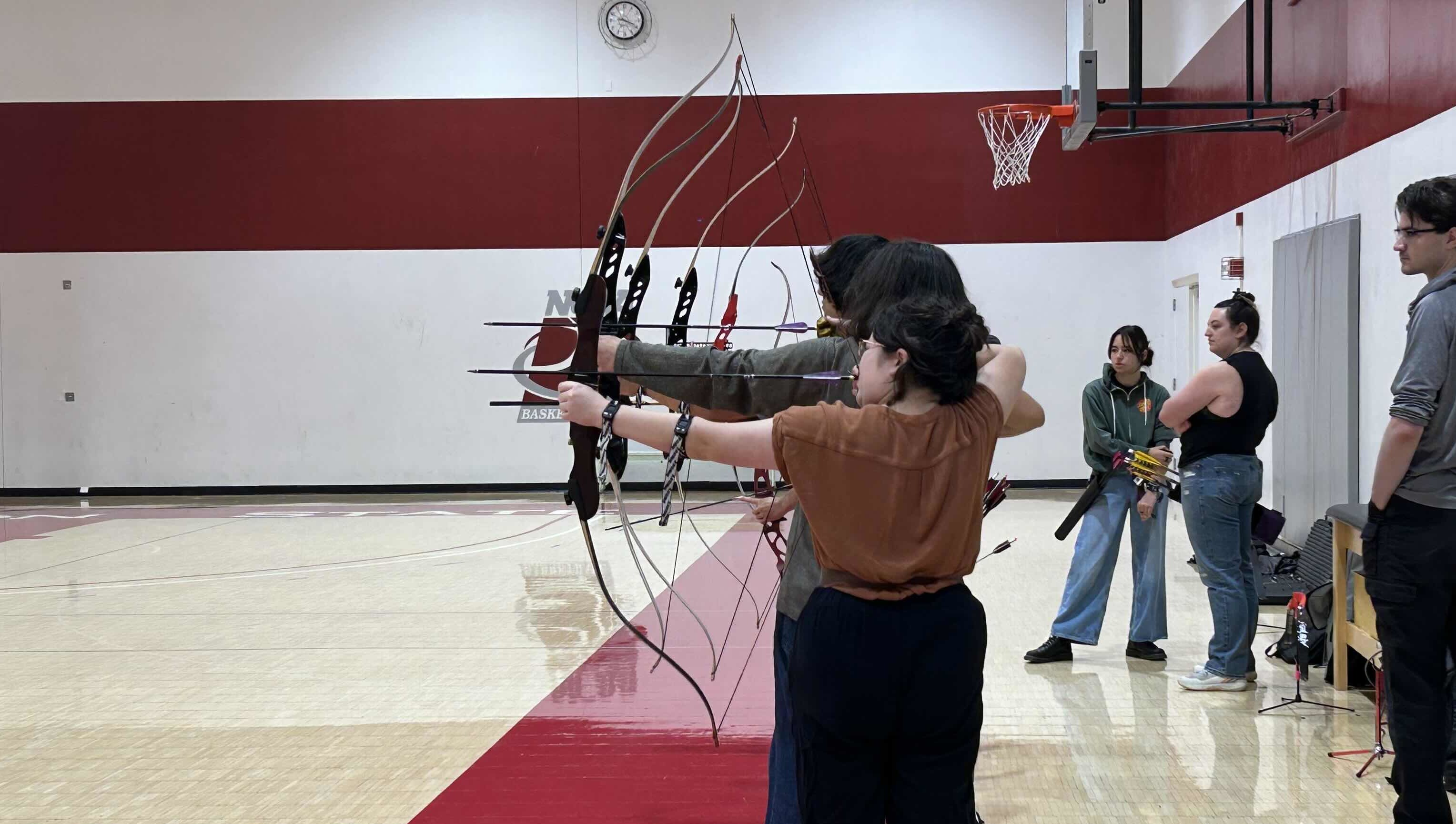 Archers lining up shots