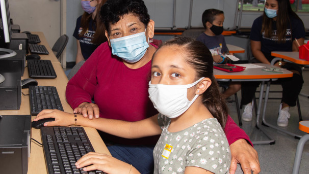 Family at the Center working on computers