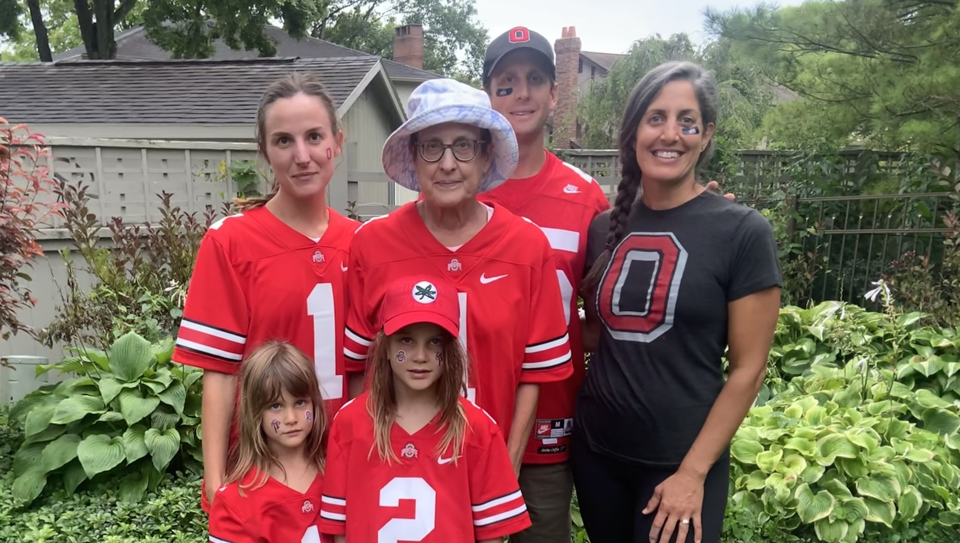 Becky and her family wearing Ohio State gear for game day