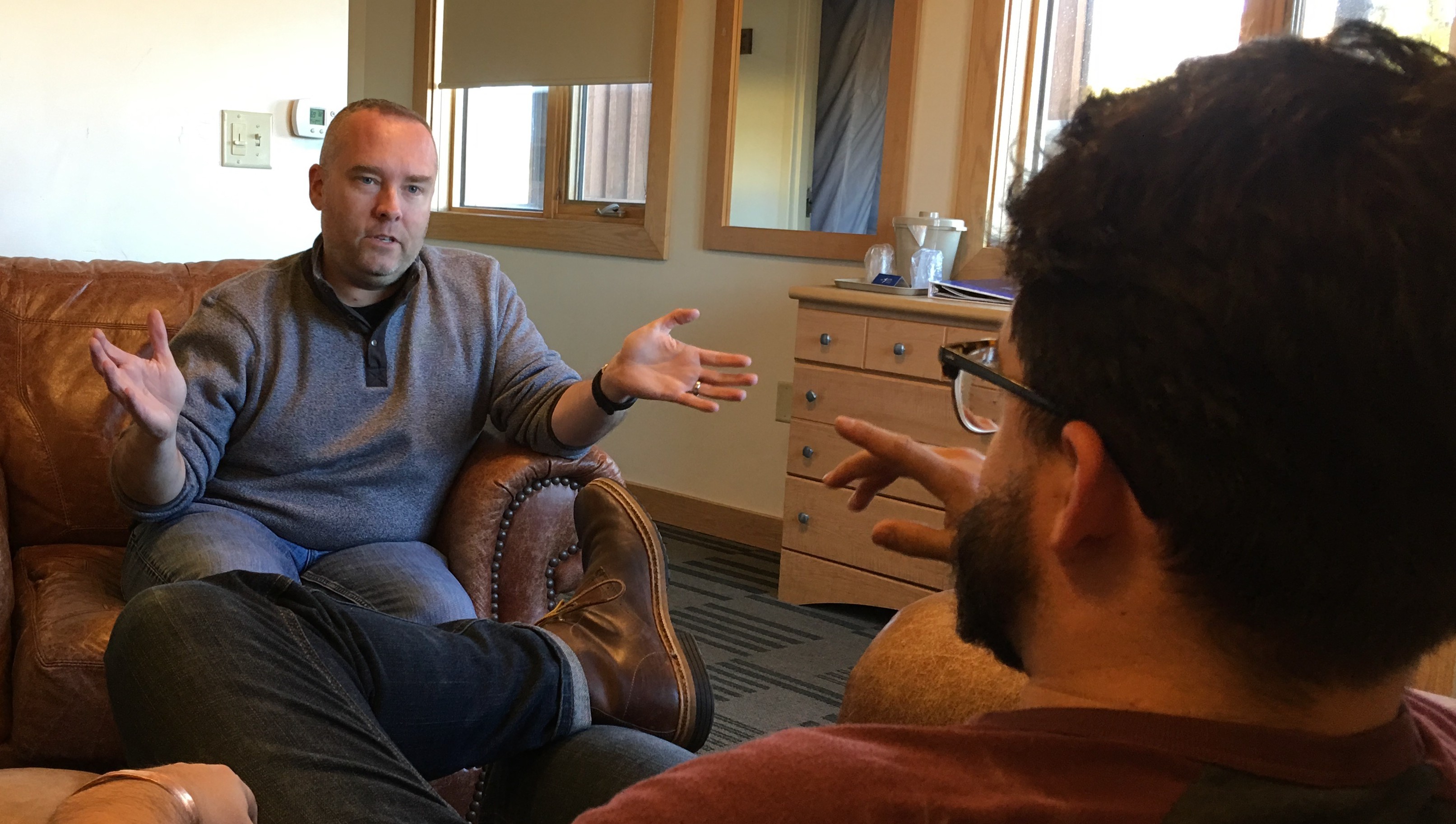 Two individuals hugging