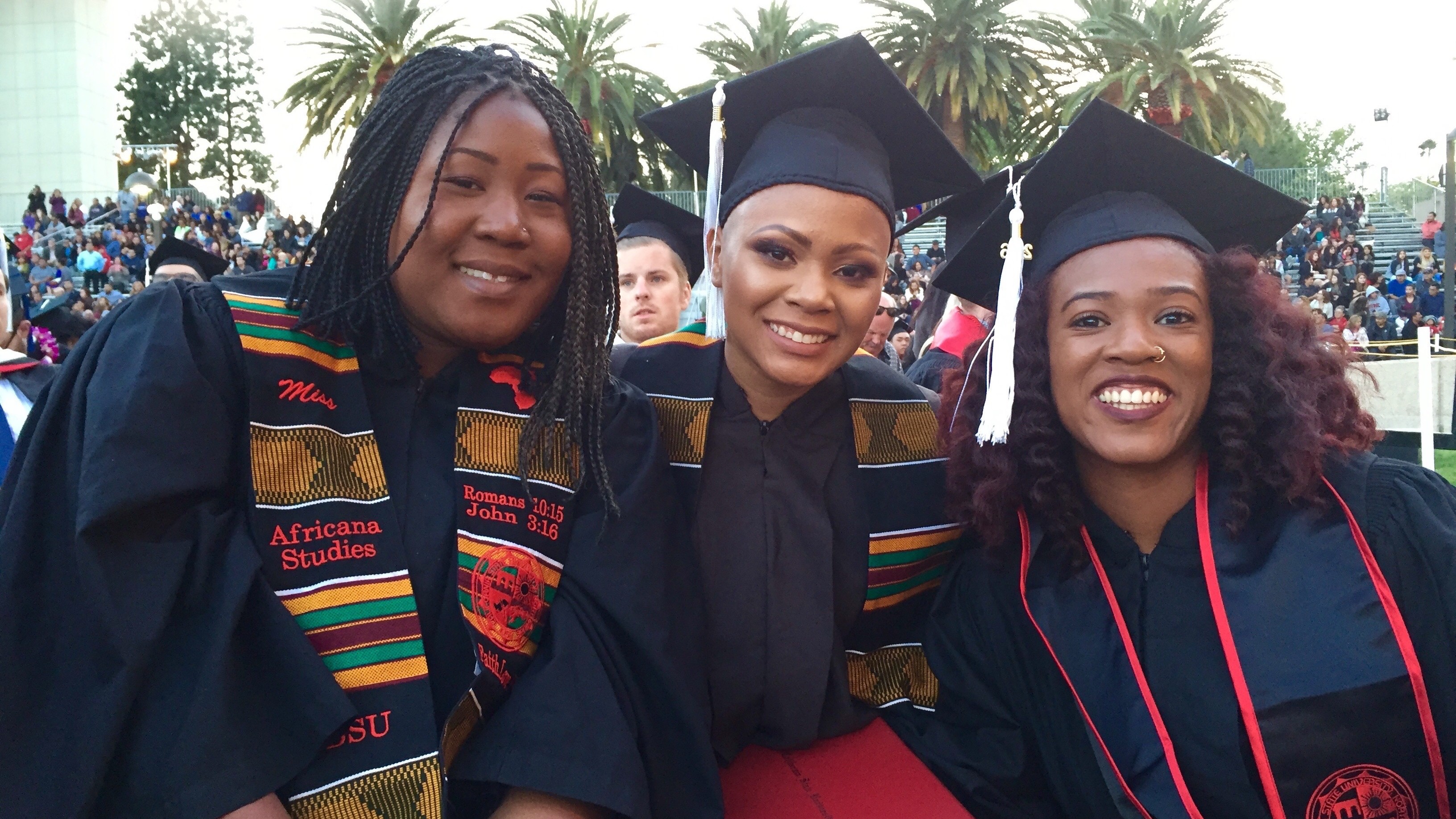 Graduating students celebrate with kente stoles and smiles at CSUN commencement.