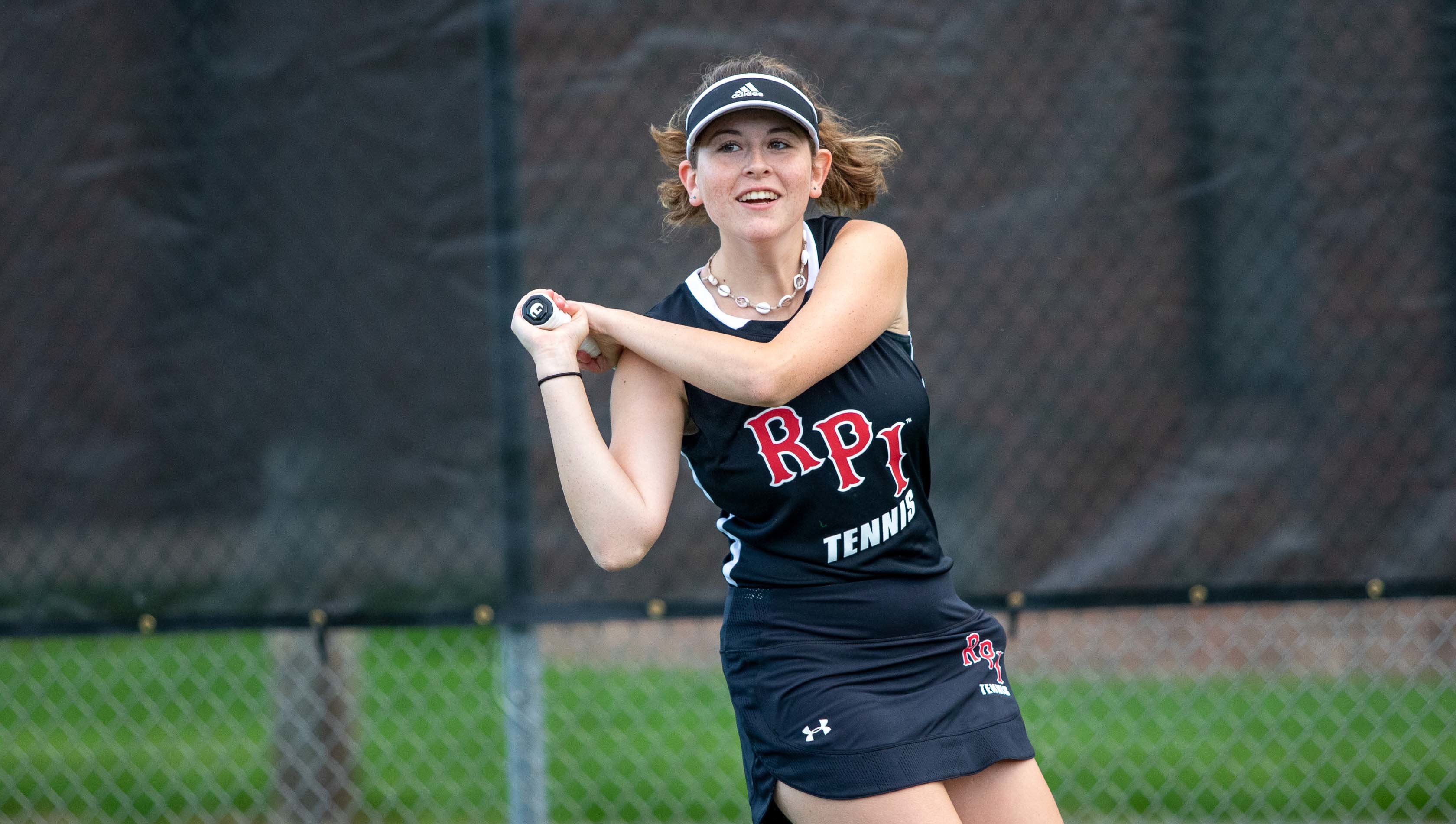 Women's tennis player on the court.