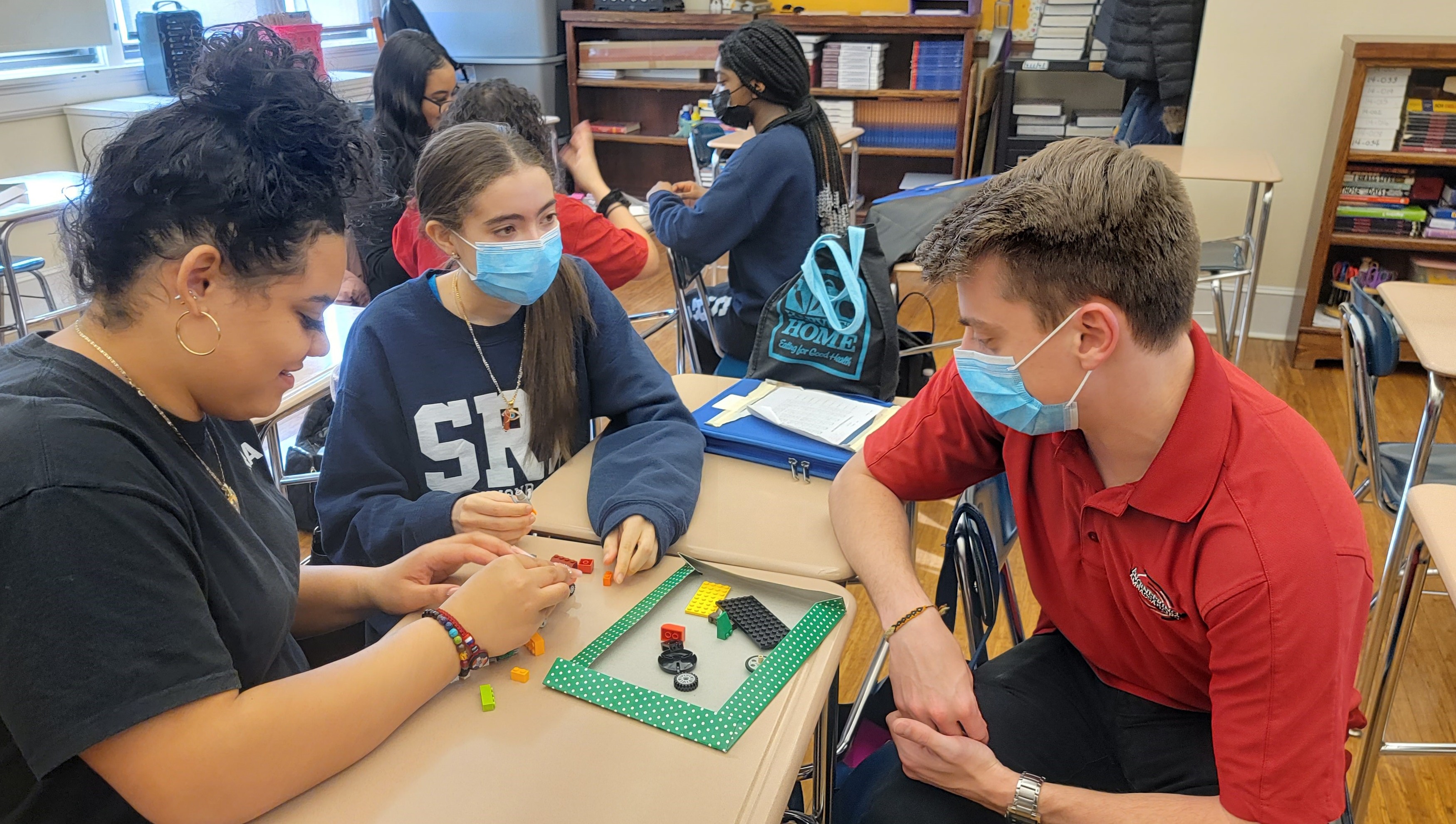 Students in a classroom working on a project.