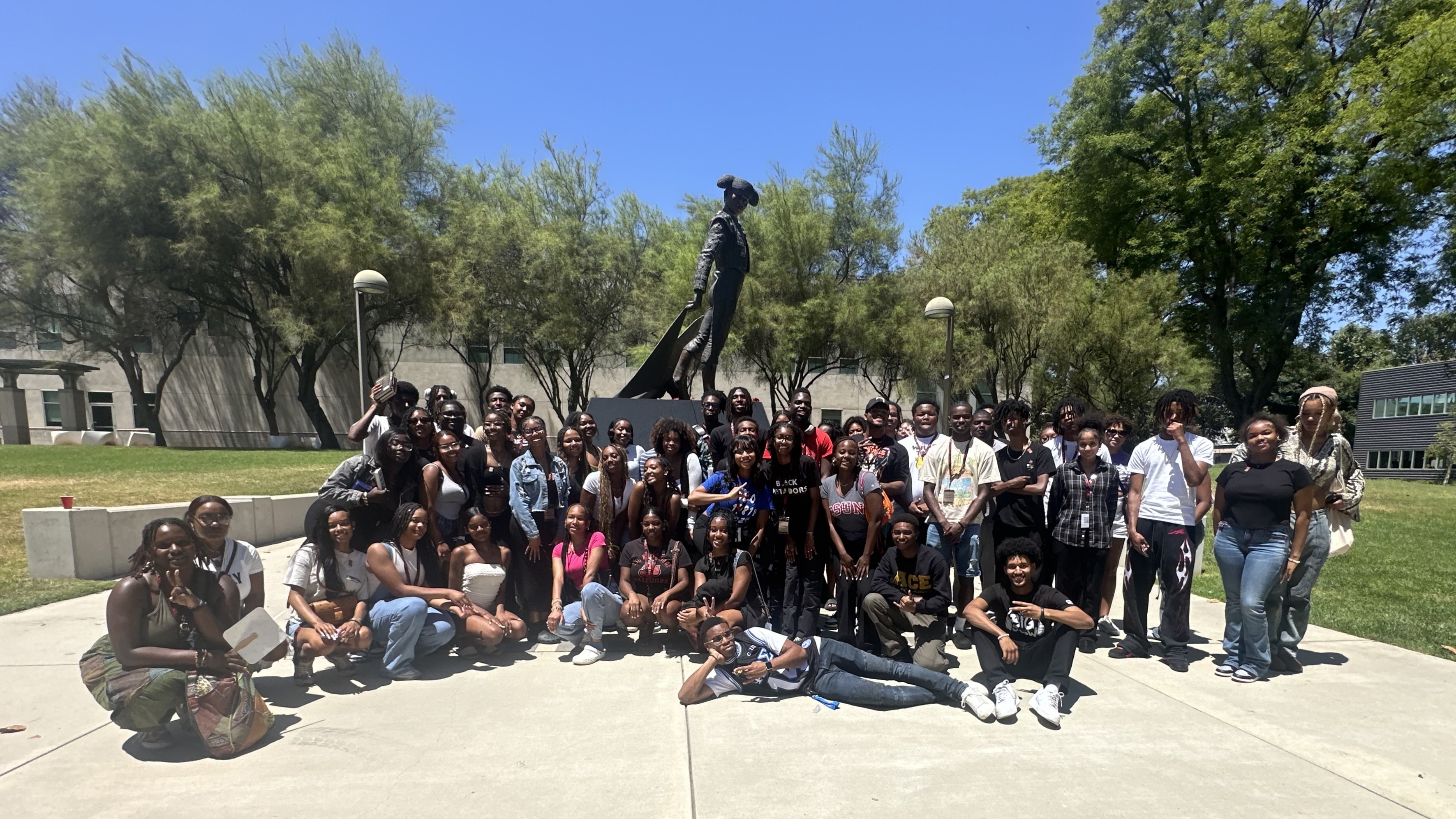 CSUN Black House students gather by the Matador statue for a community event.