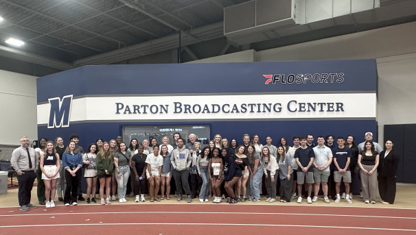 The Monmouth Digital Network staff in a group photo in front of the Parton Broadcast Center