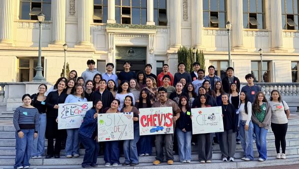 CHE students in a group photo on the steps outside Doe Library.