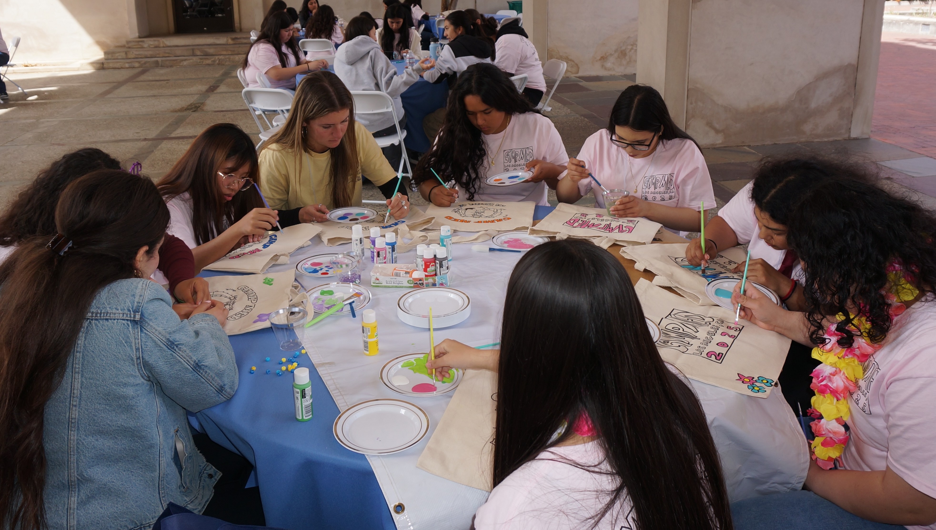 Campers decorating tote bags