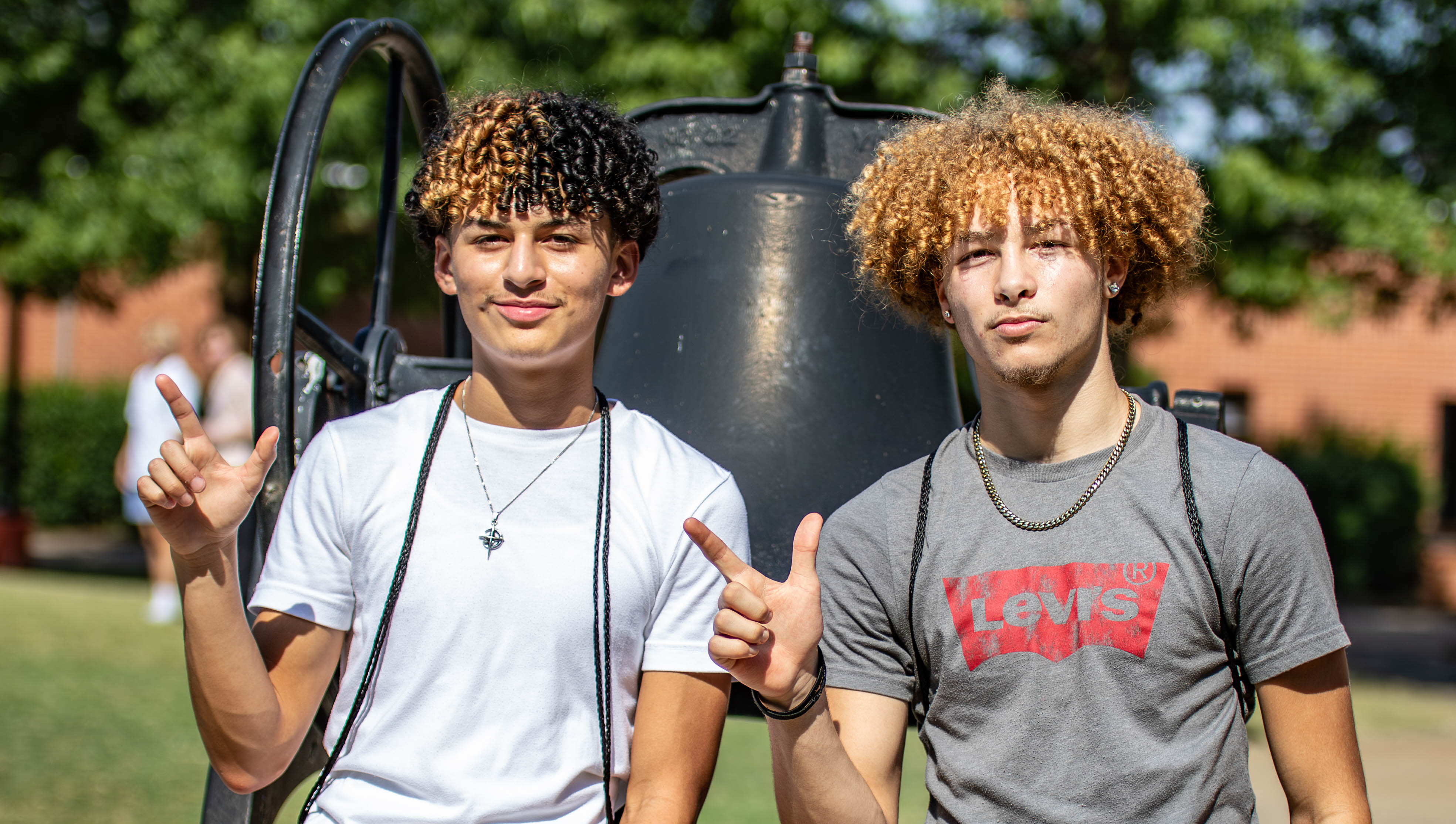 Students post by the chapel bell, one of the few existing landmarks on the OSUIT quad