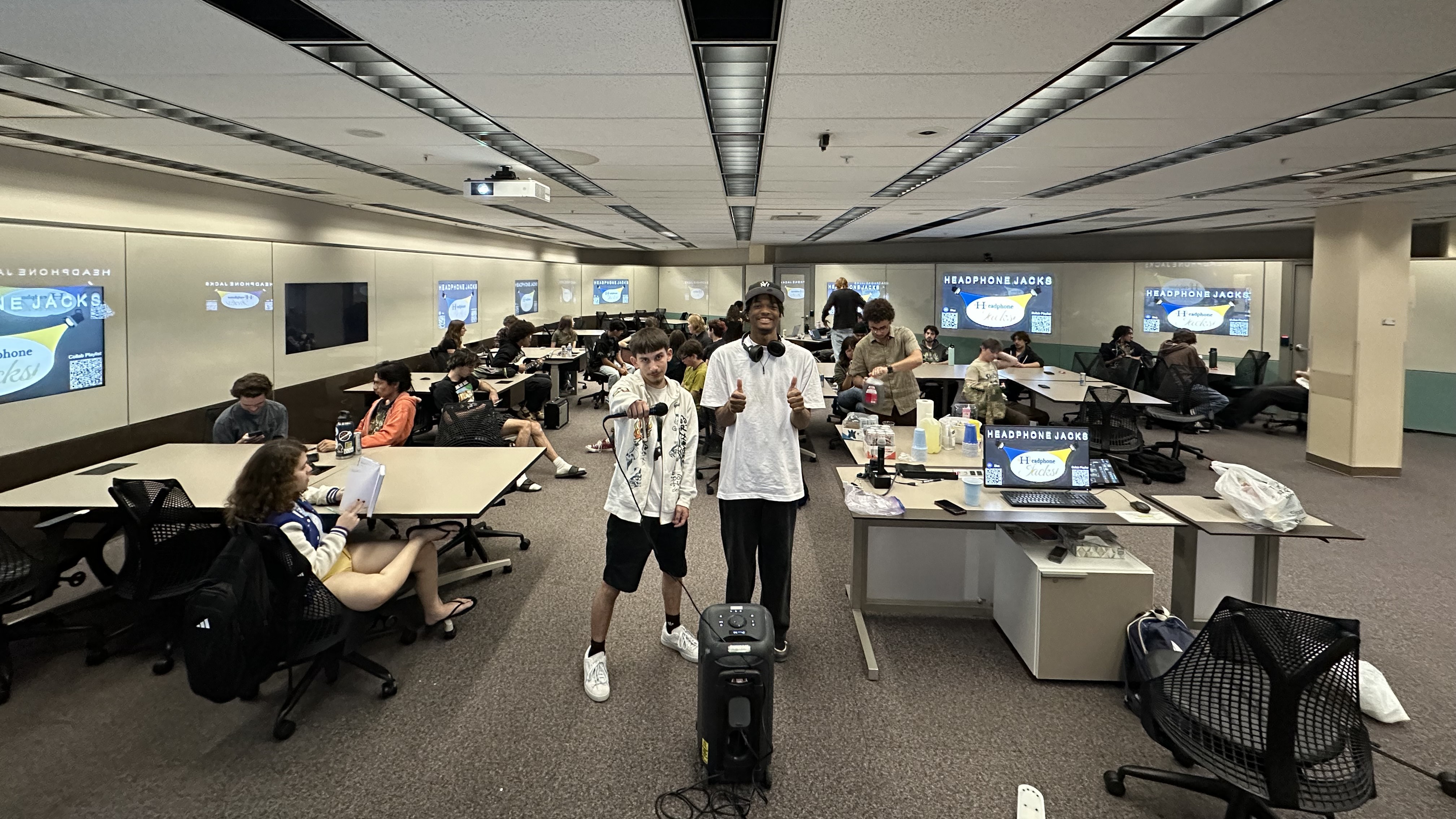 Two students at a Headphone Jacks meeting