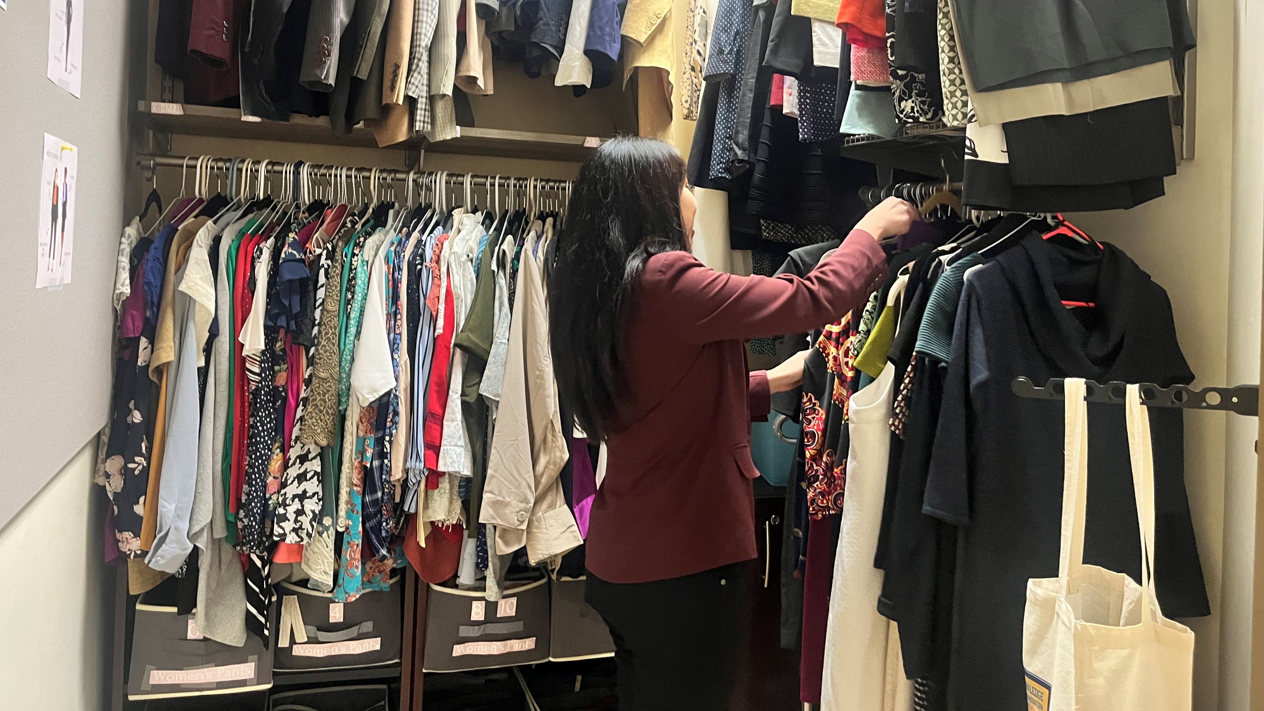 Student selects professional attire in Nazarian College Dean’s Career Closet.