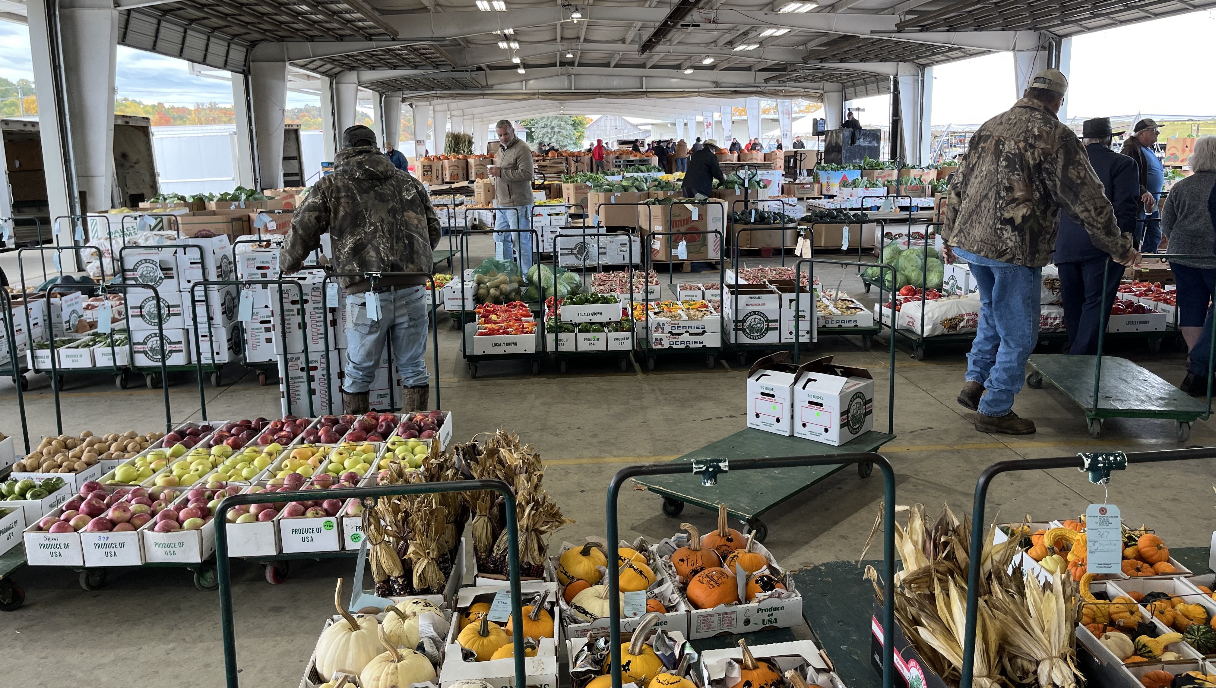 Individual named Logan Rohr standing and talking at 3D Meats