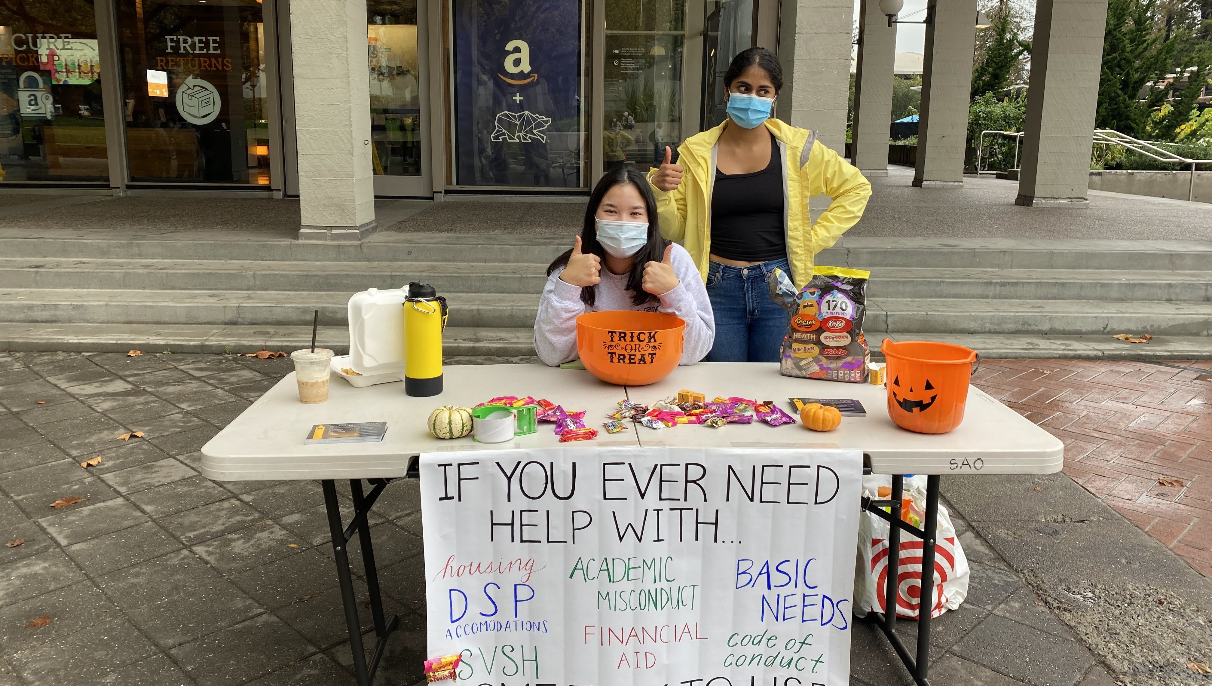 Caseworkers advertising our services with some complimentary Halloween candy!