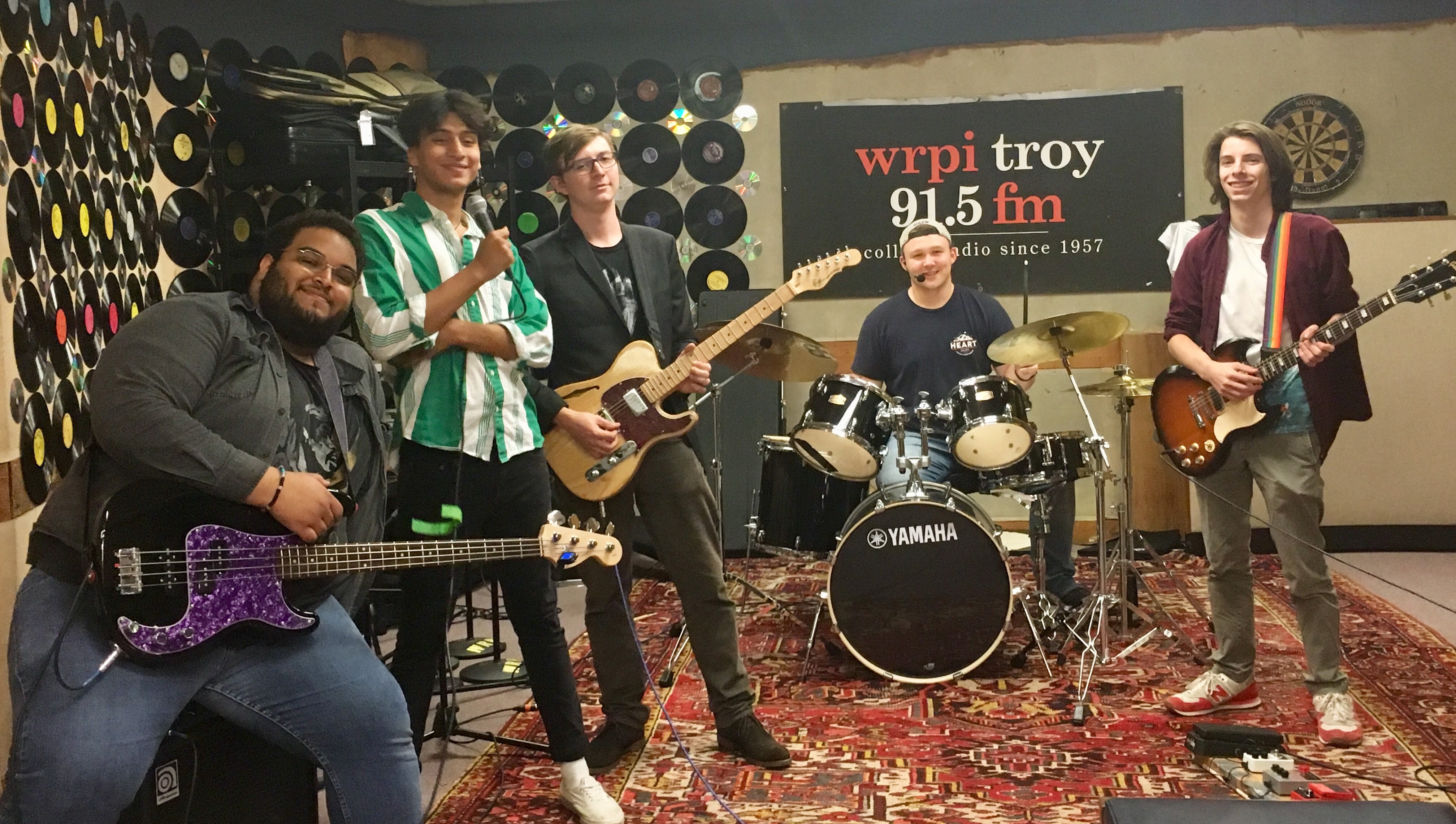 A group of student musicians performing in the studio