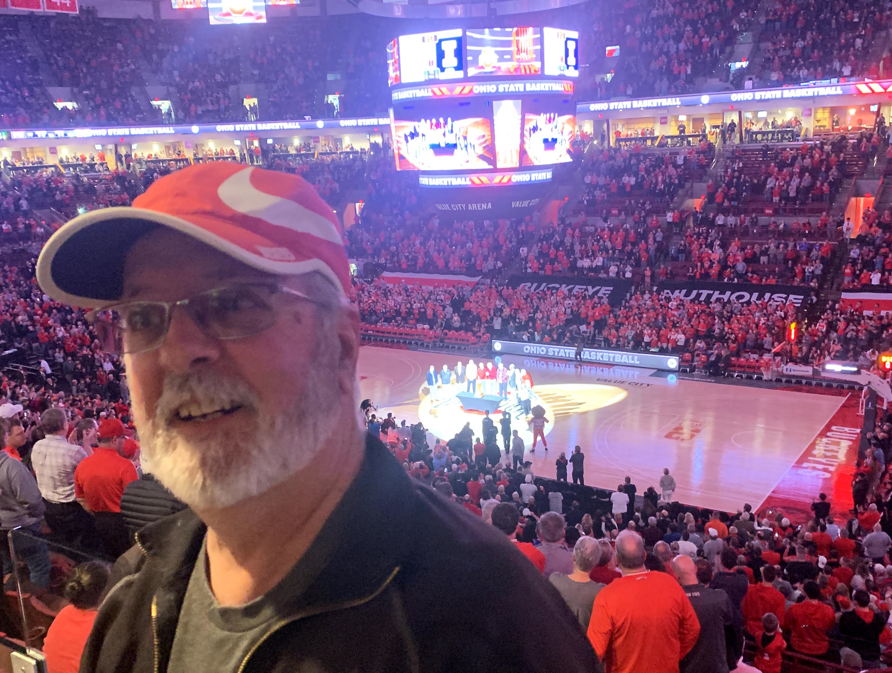 A man standing with his back towards the OSU basketball court