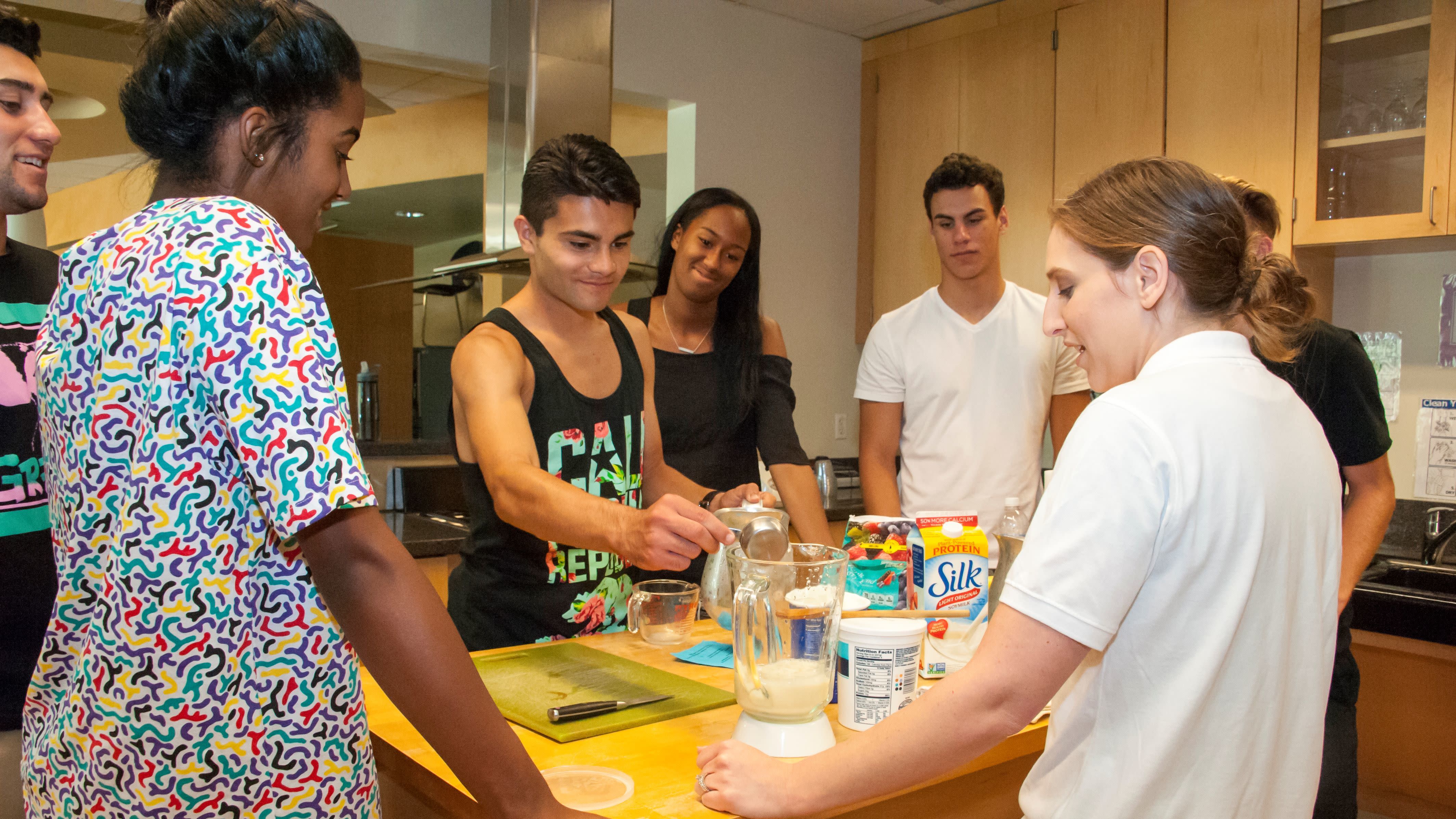 Students in a CSUN lab kitchen testing food products.