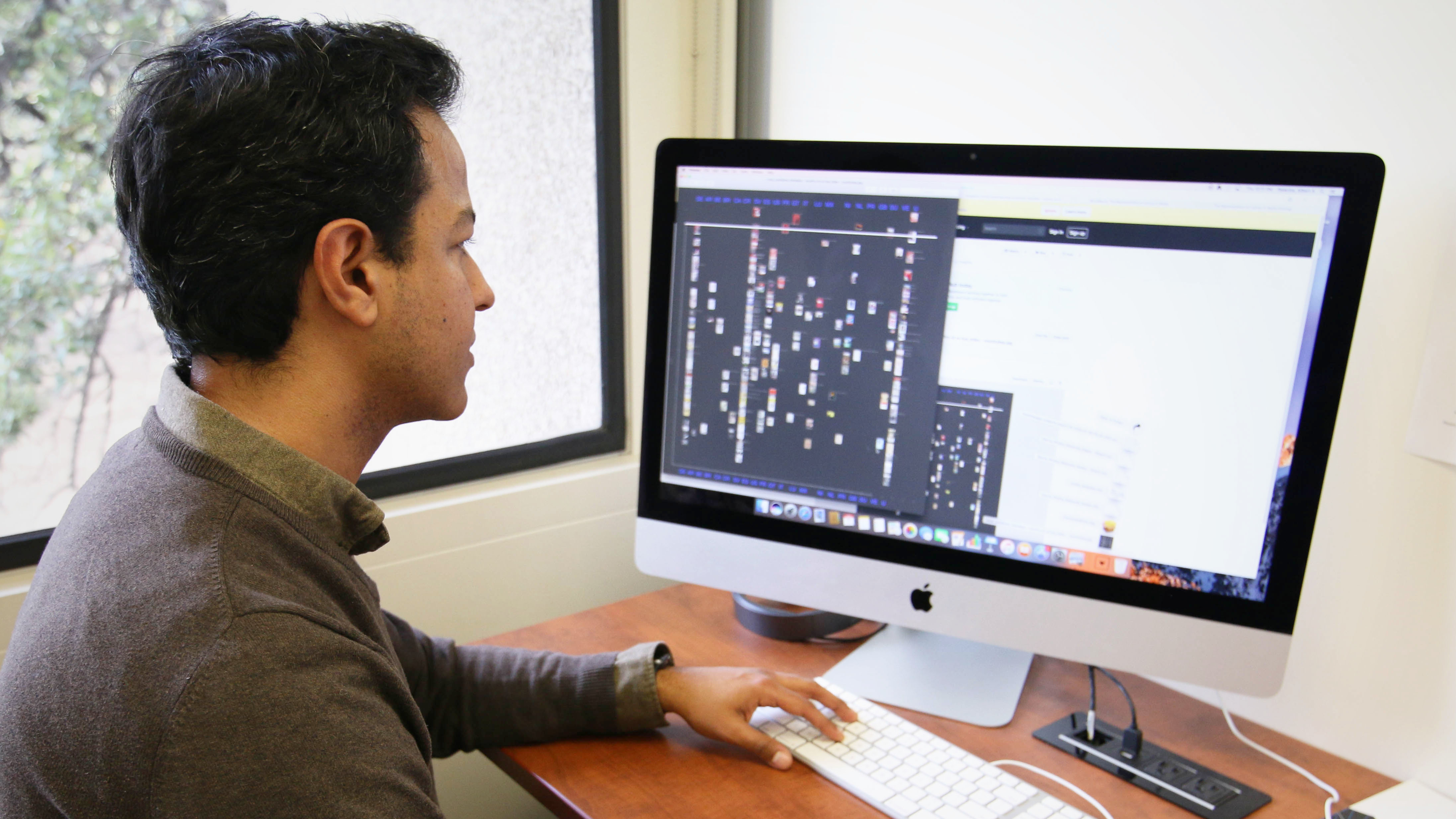 A scholar conducting digital research in the Digital Scholars Lab