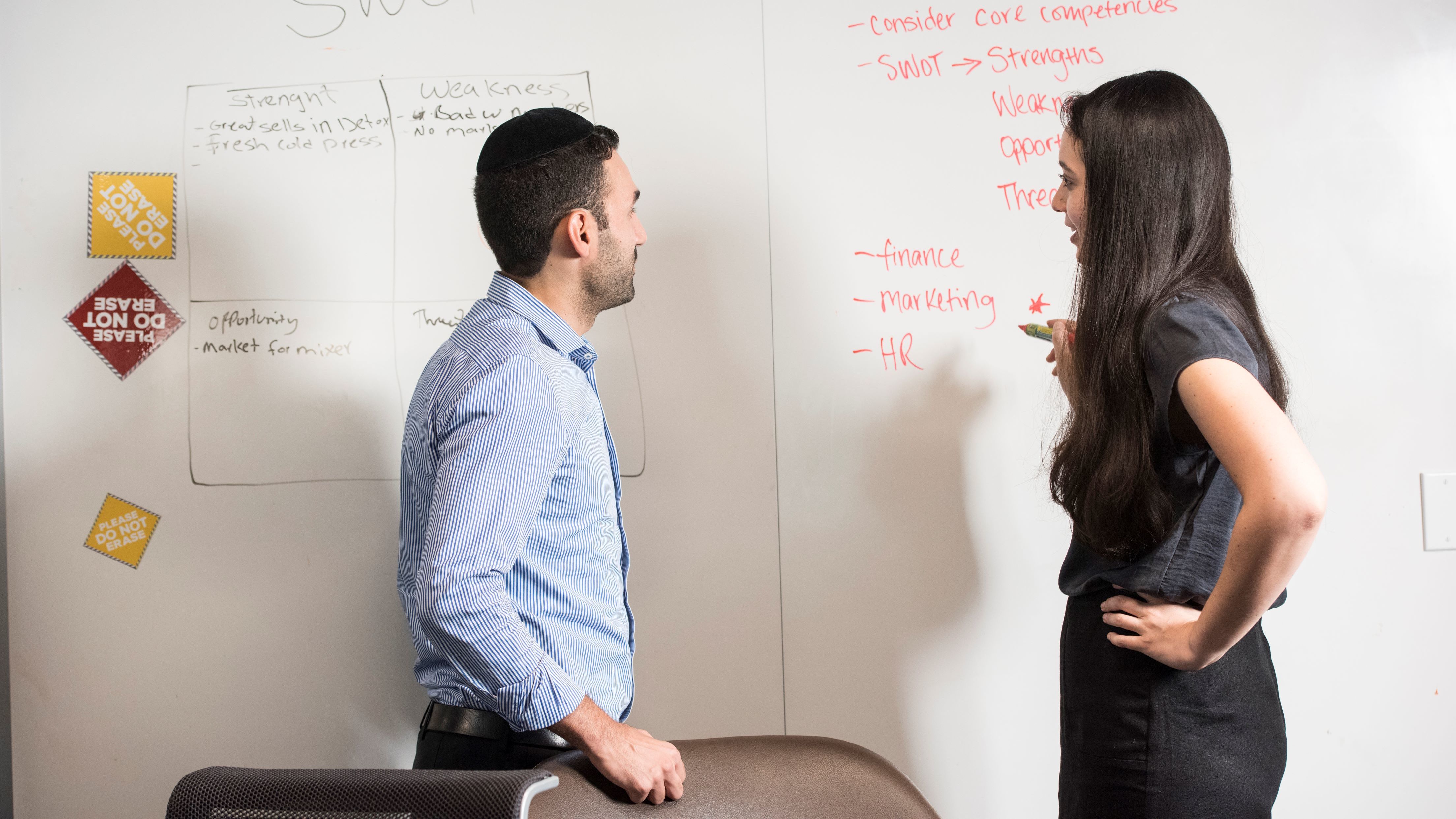 Two business students discussing a class lecture.
