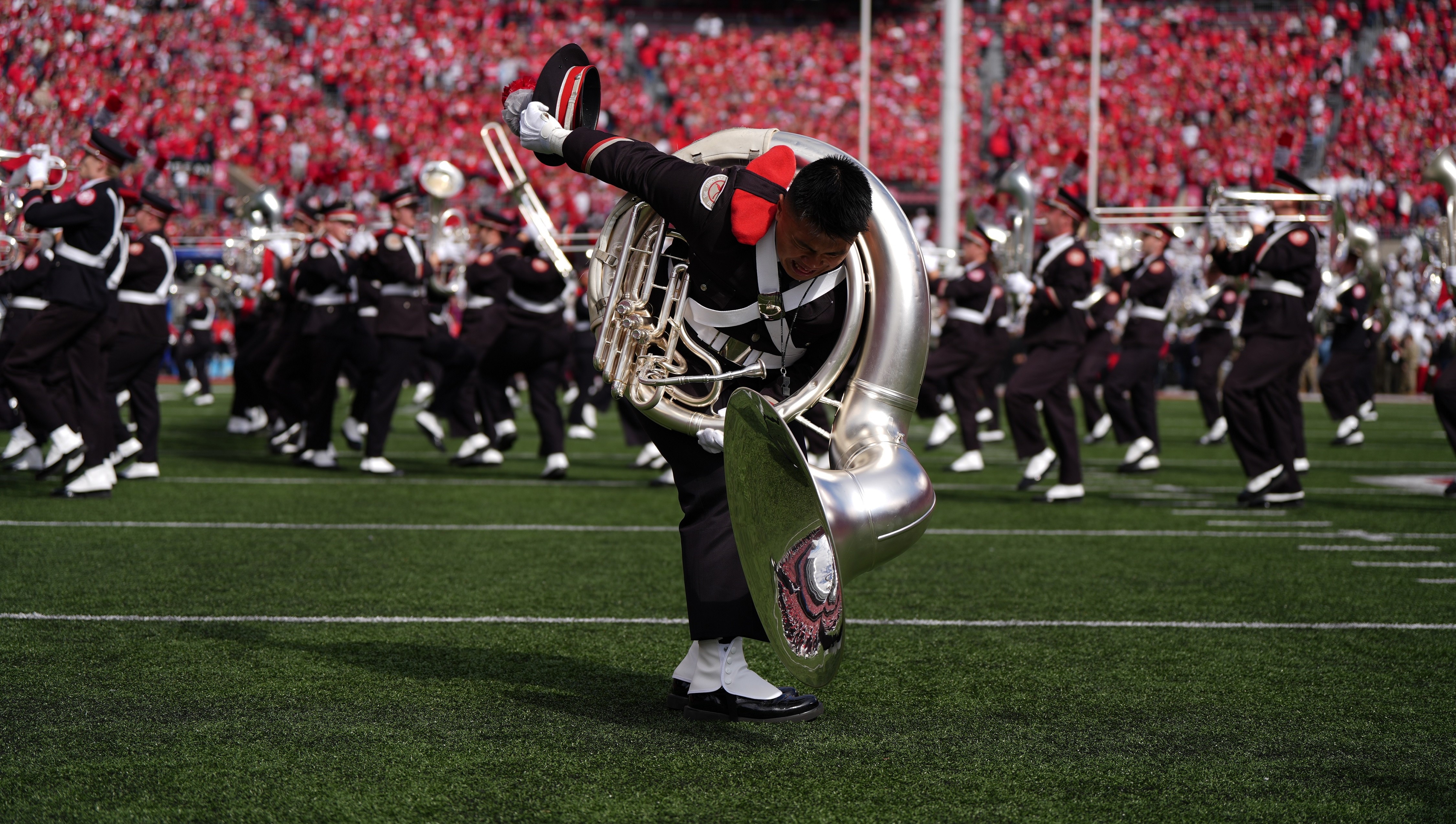 The Ohio State University Marching Band member dotting the I on the field