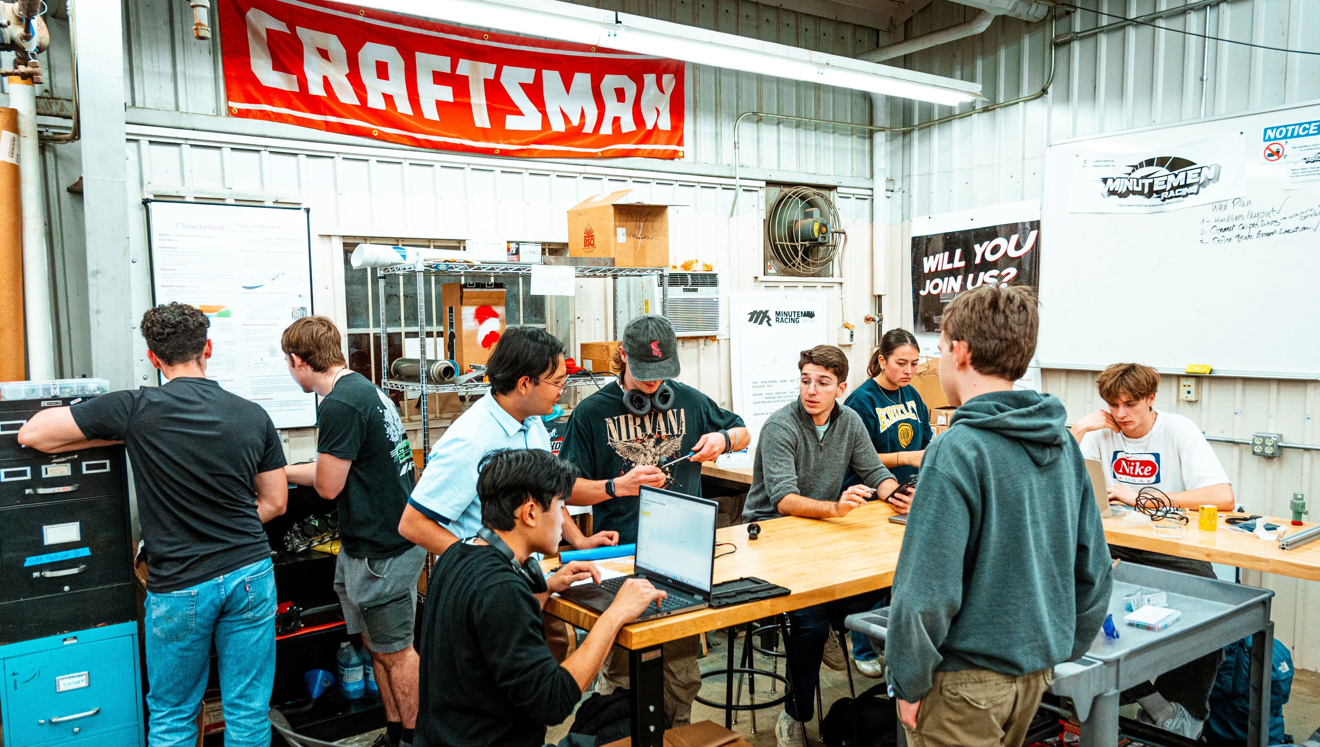 Minutemen racing students working.