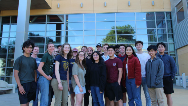 The Lower Limb Exoskeleton Assist Project team posing on campus.