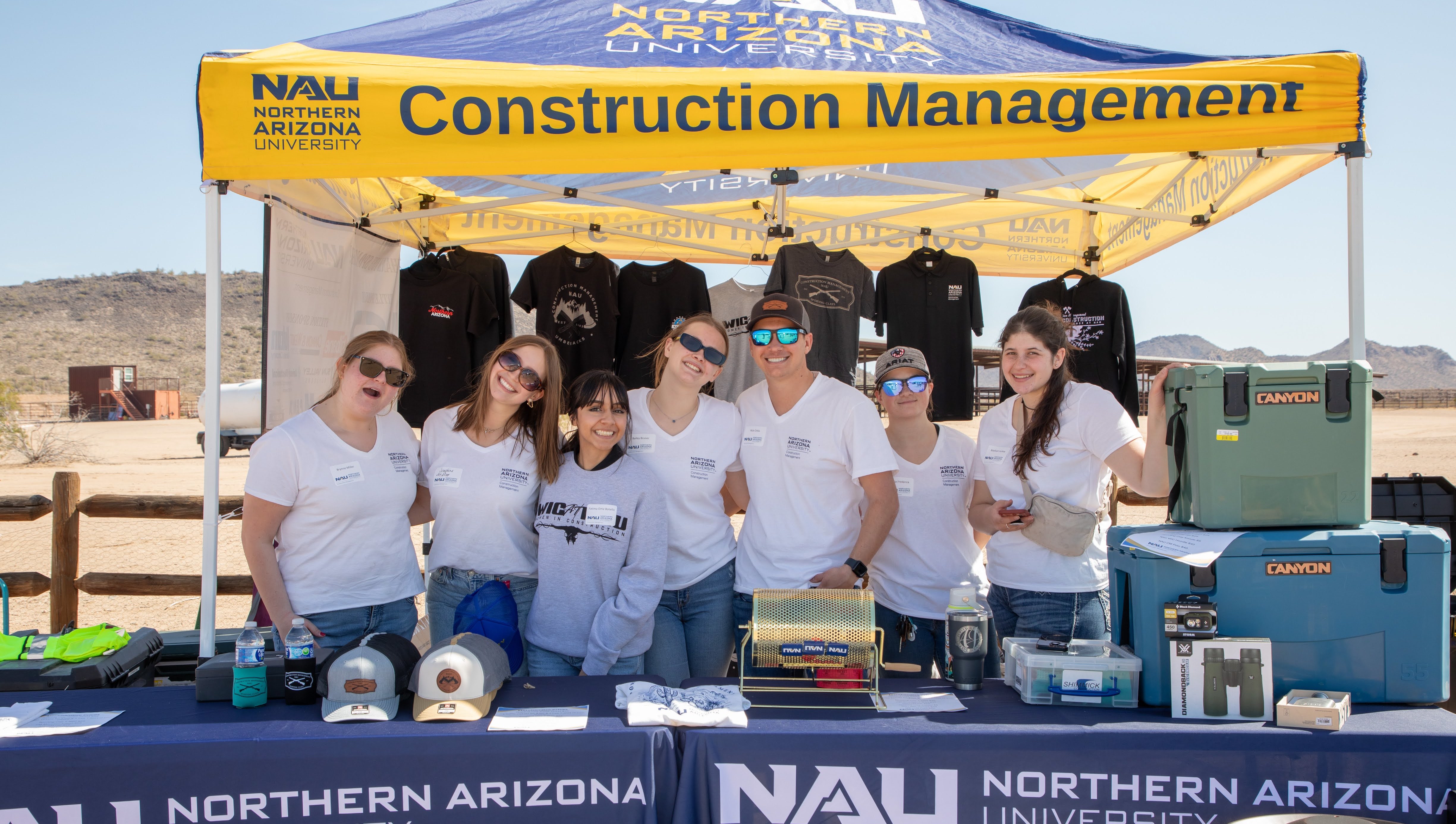 NAU Construction Management Staff working a booth at the event