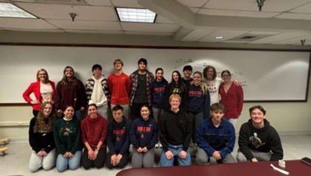 group of dusat students smiling in a group picture